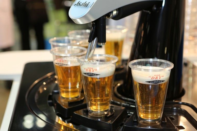 asahi s robot barman pours six perfect beers every time image 1
