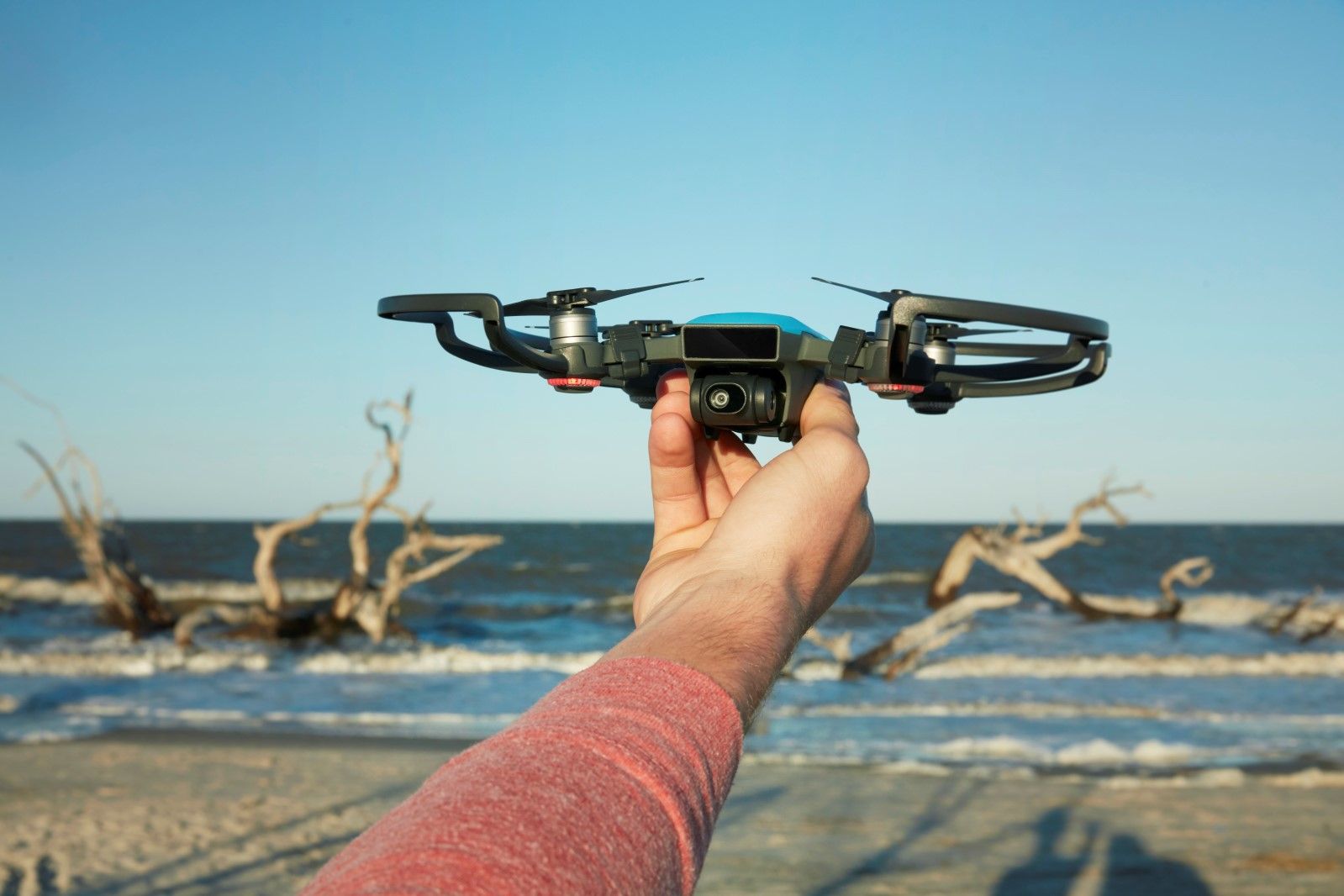 dji spark is a very smart tiny drone that fits in your hand image 1