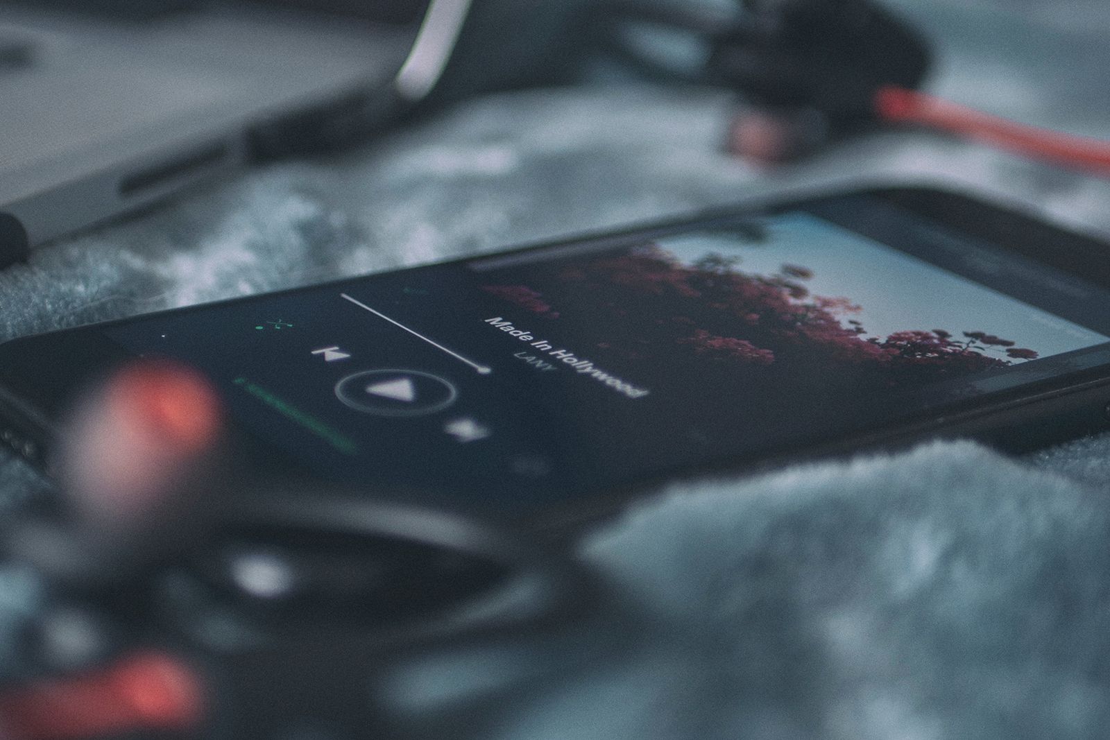 Spotify on a phone on a gray surface