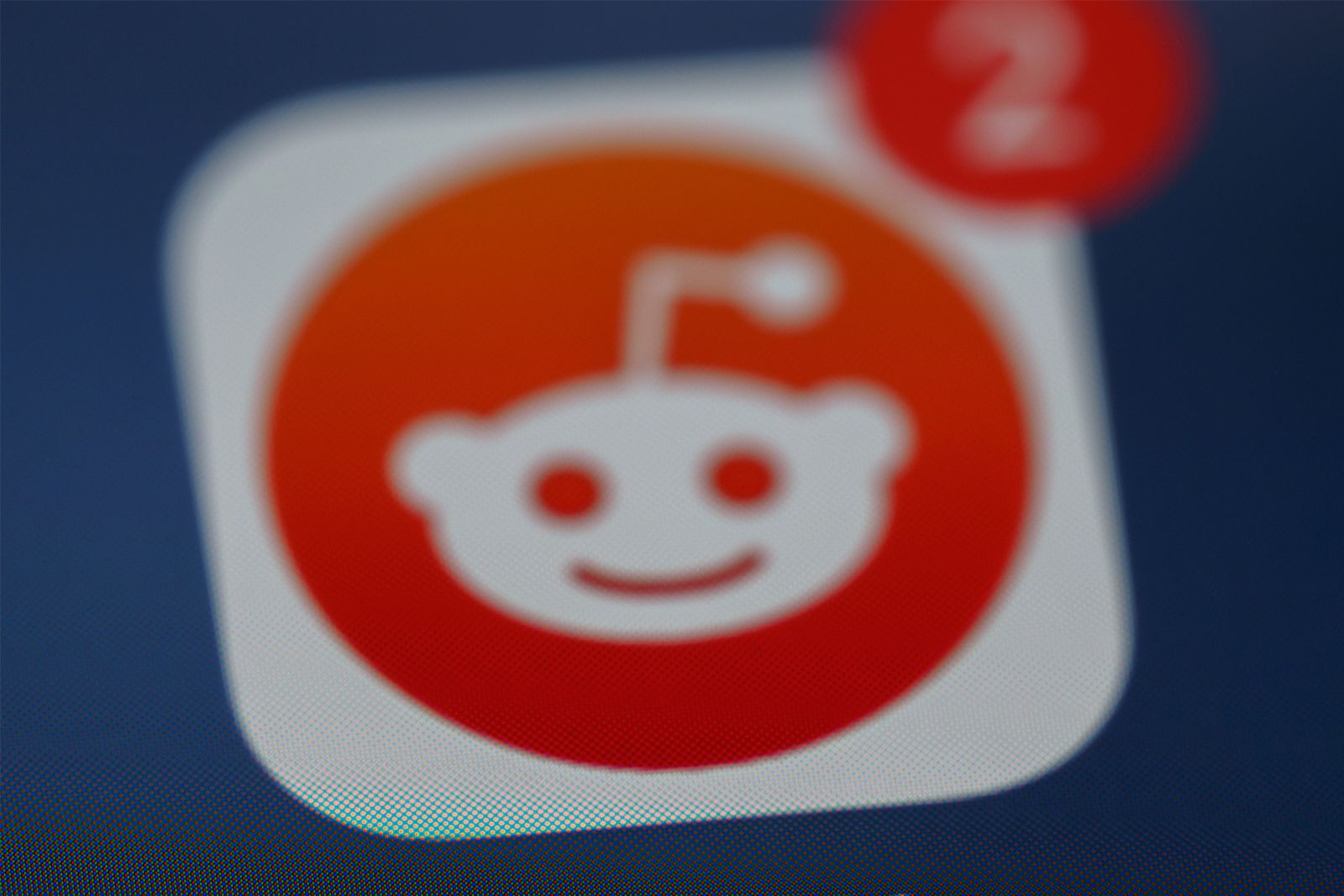 Reddit app logo zoomed in on an iPhone