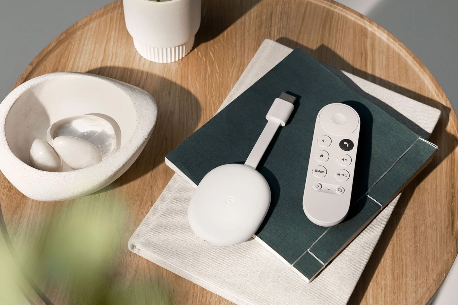 Google Chromecast and remote on a wooden table