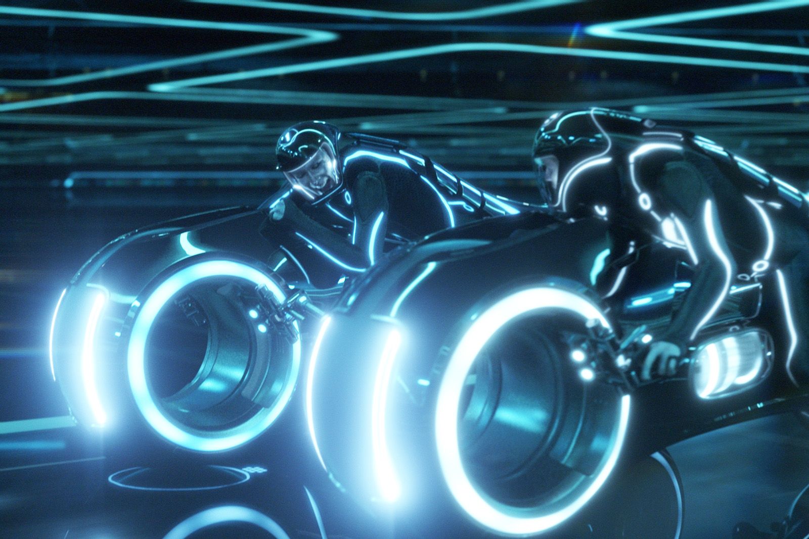 Tron Legacy still - two characters on bikes