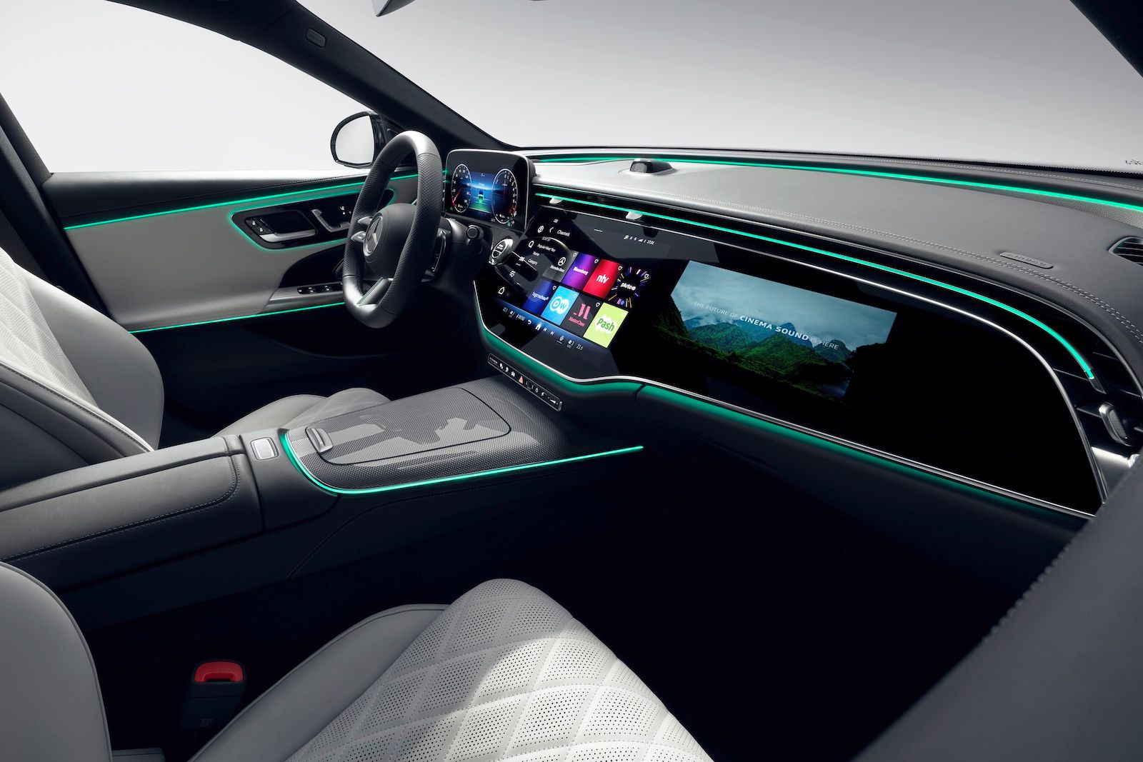Mercedes-Benz E-Class Interior showing big-screen display, white seats