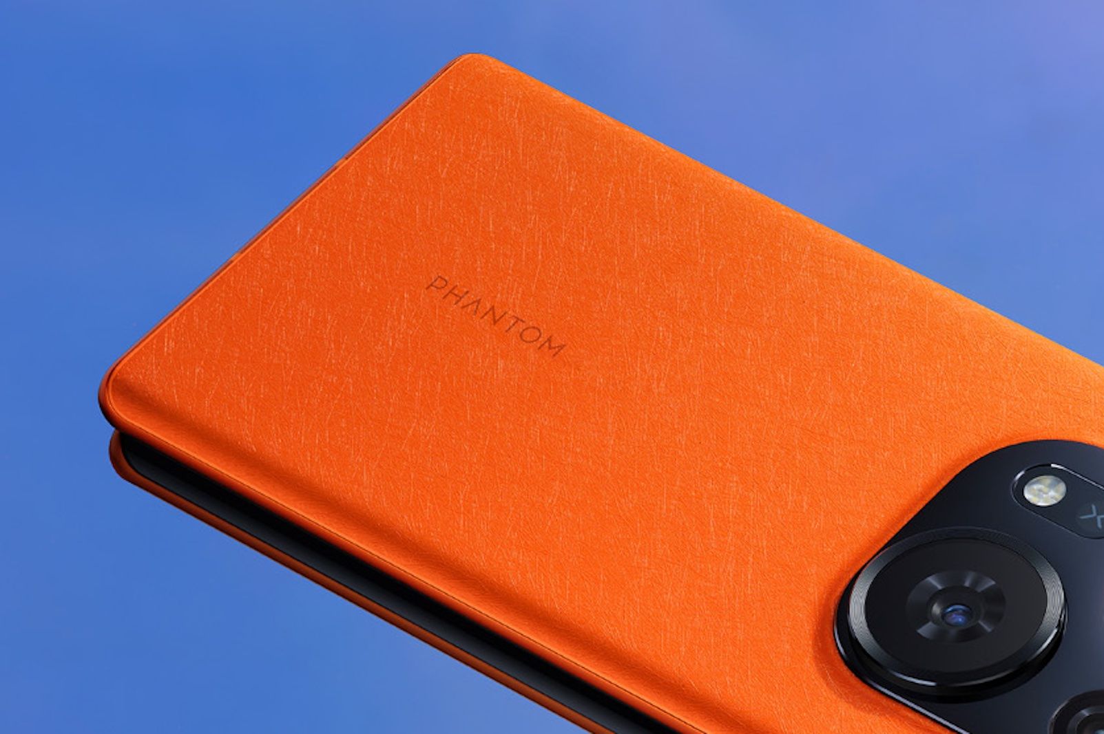 Tecno Phantom phone in orange on blue background