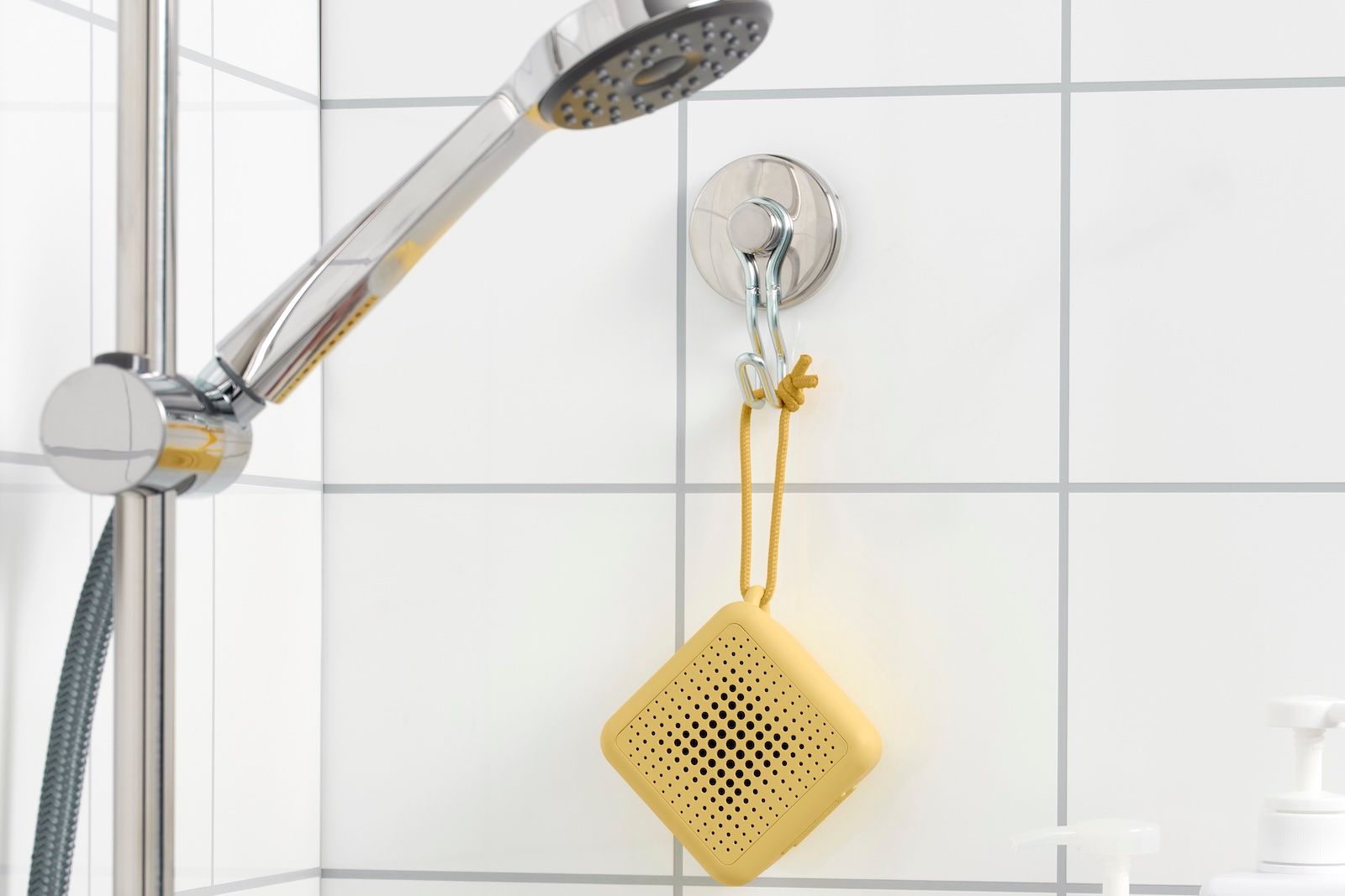 IKEA VAPPEBY Bluetooth speaker in yellow in a shower