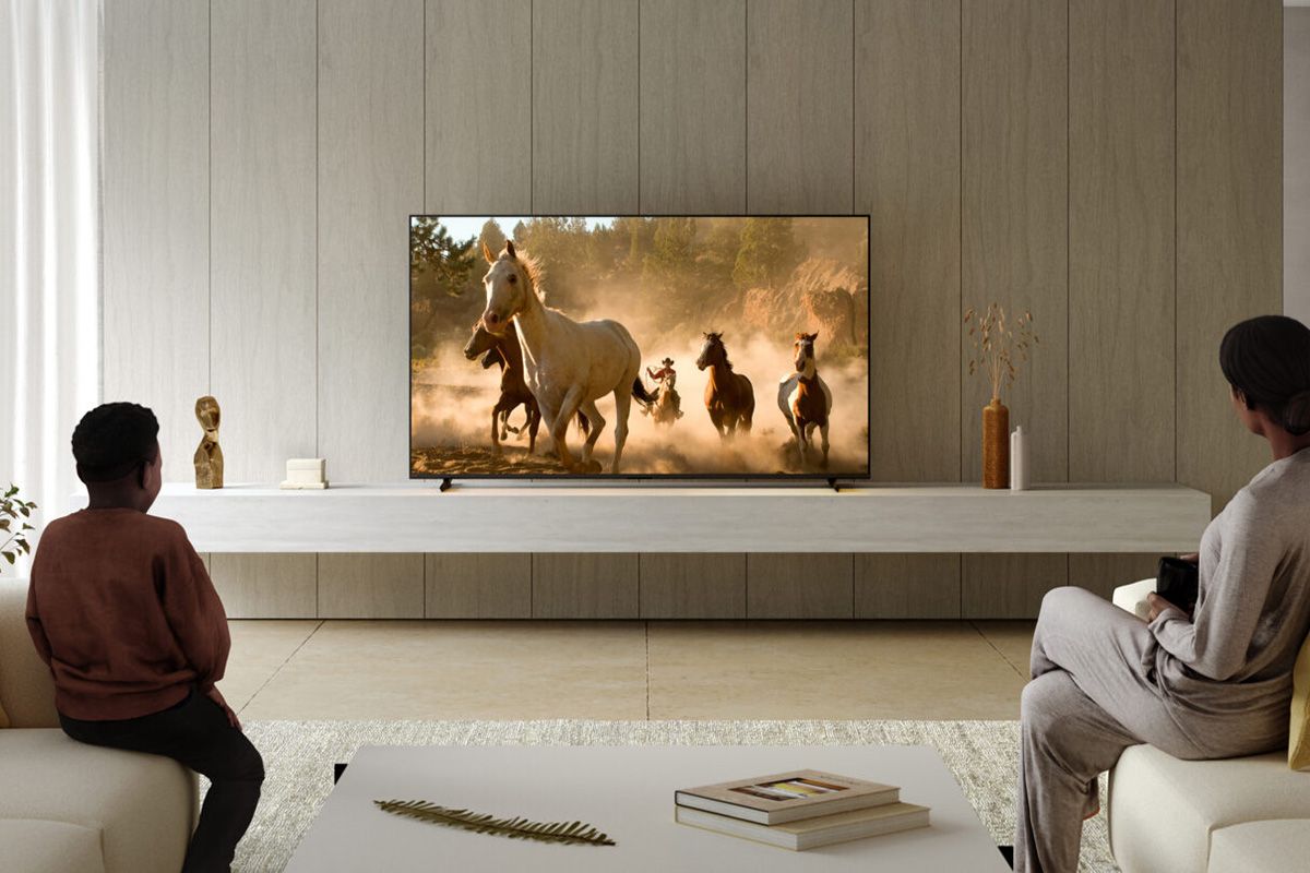Sony Bravia XR TV range 2023 watched by lady and young boy