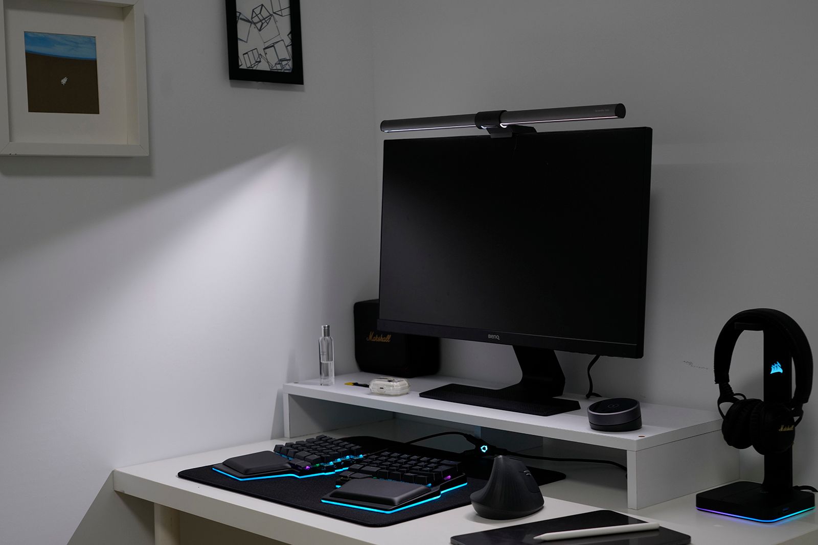 The BenQ ScreenBar Halo monitor bar displays its asymmetrical light