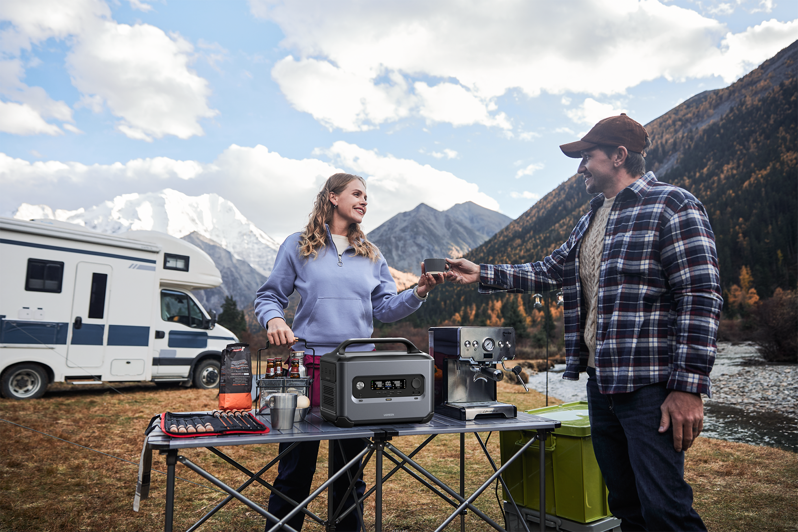 A woman and a man use a Ugreen PowerRoam 1200 power station while camping