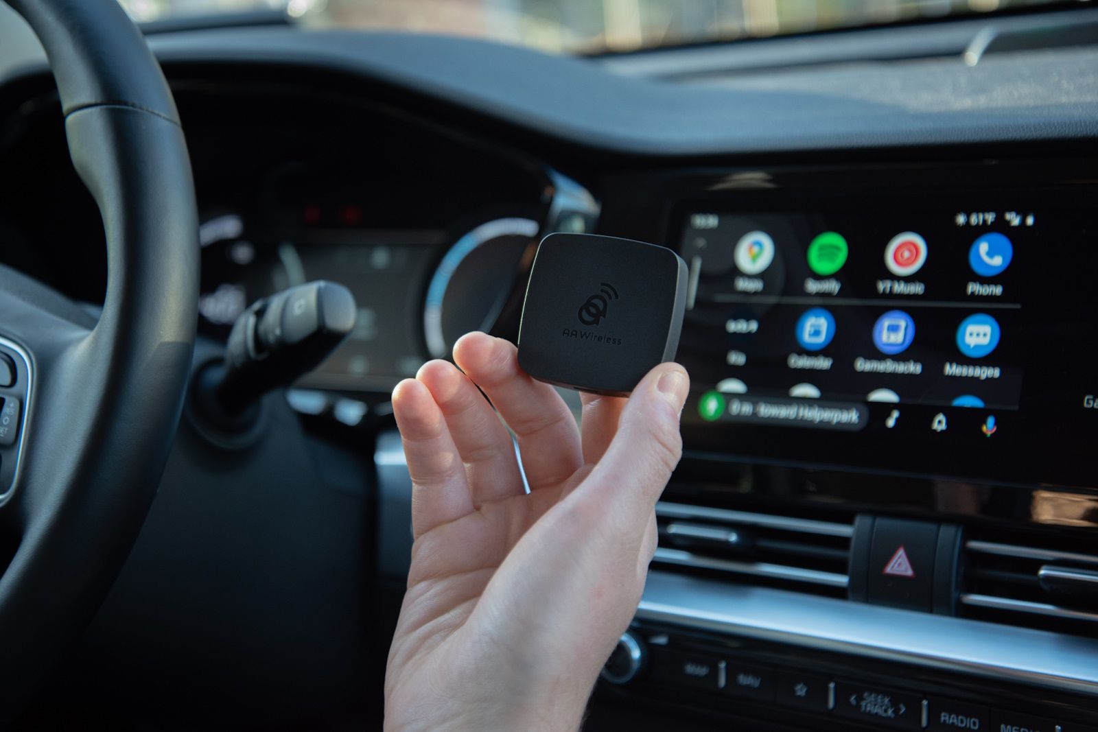 Holding wireless Android car adapter in one hand