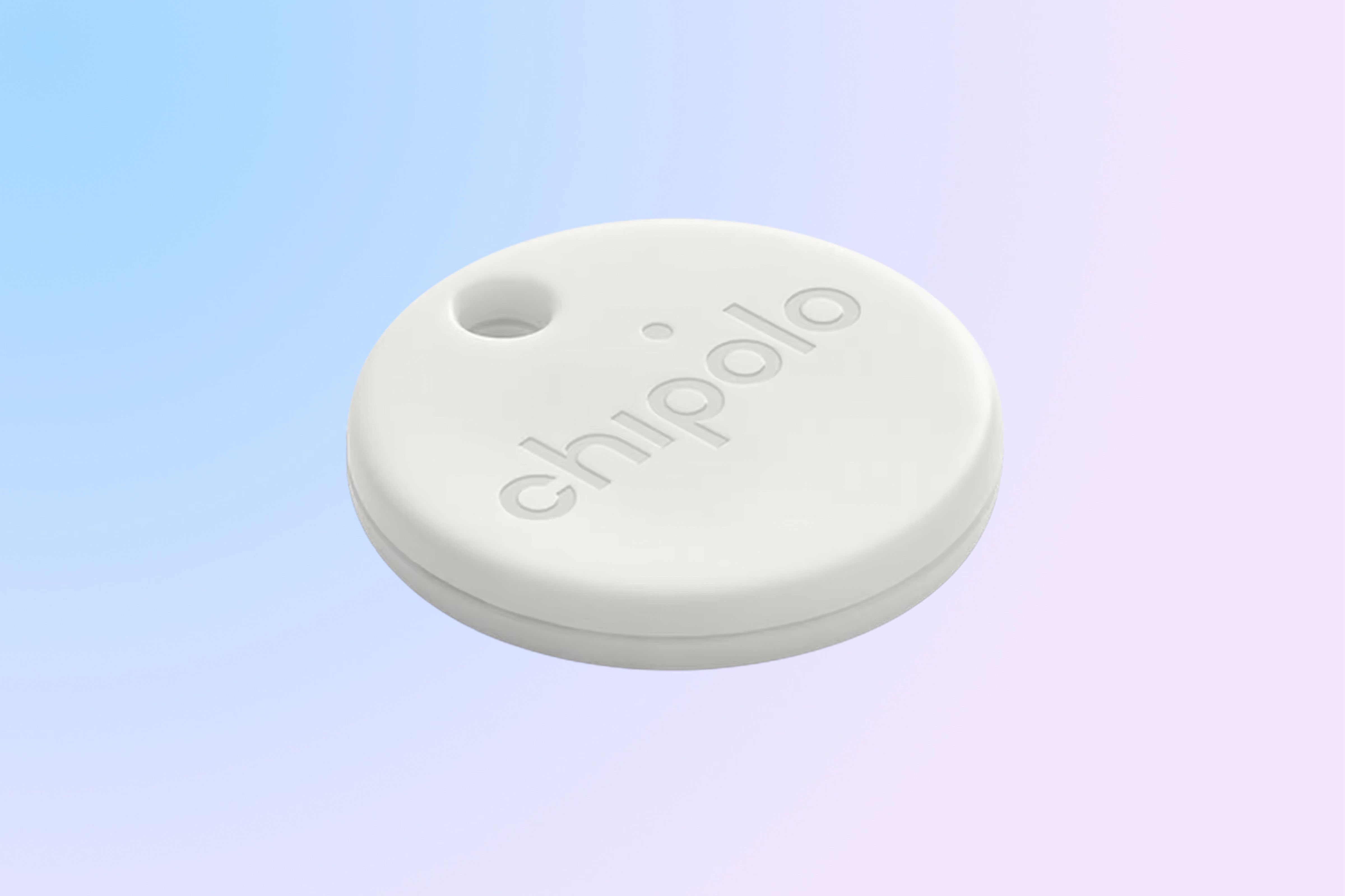 The white Chipolo One Point Bluetooth tracker with keyring hole and logo visible over a bluish-pink background. 