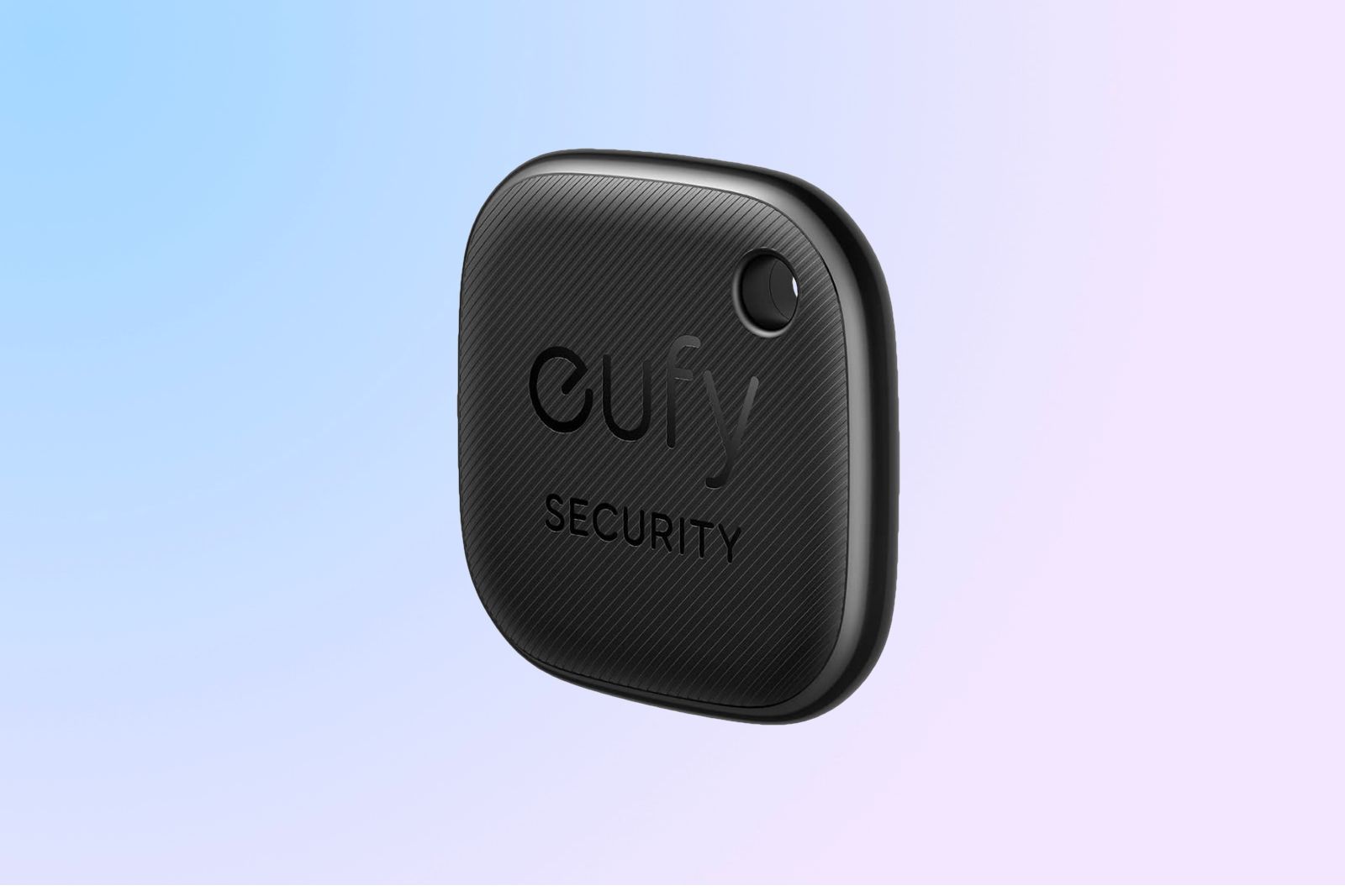 The Eufy Security SmartTrack Link angled so that it's logo and keyring hole are visible on a bluish-pink background.