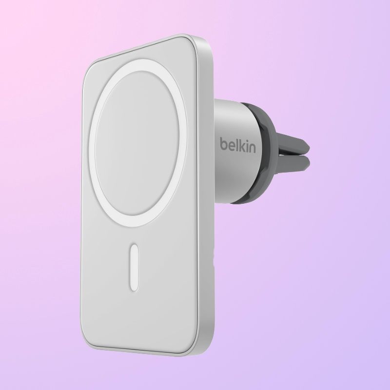A white and gray flat magnet car mount with MagSafe markings on the front.