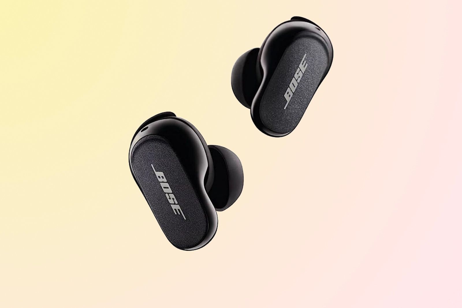 Two black earbuds with Bose written on the side.