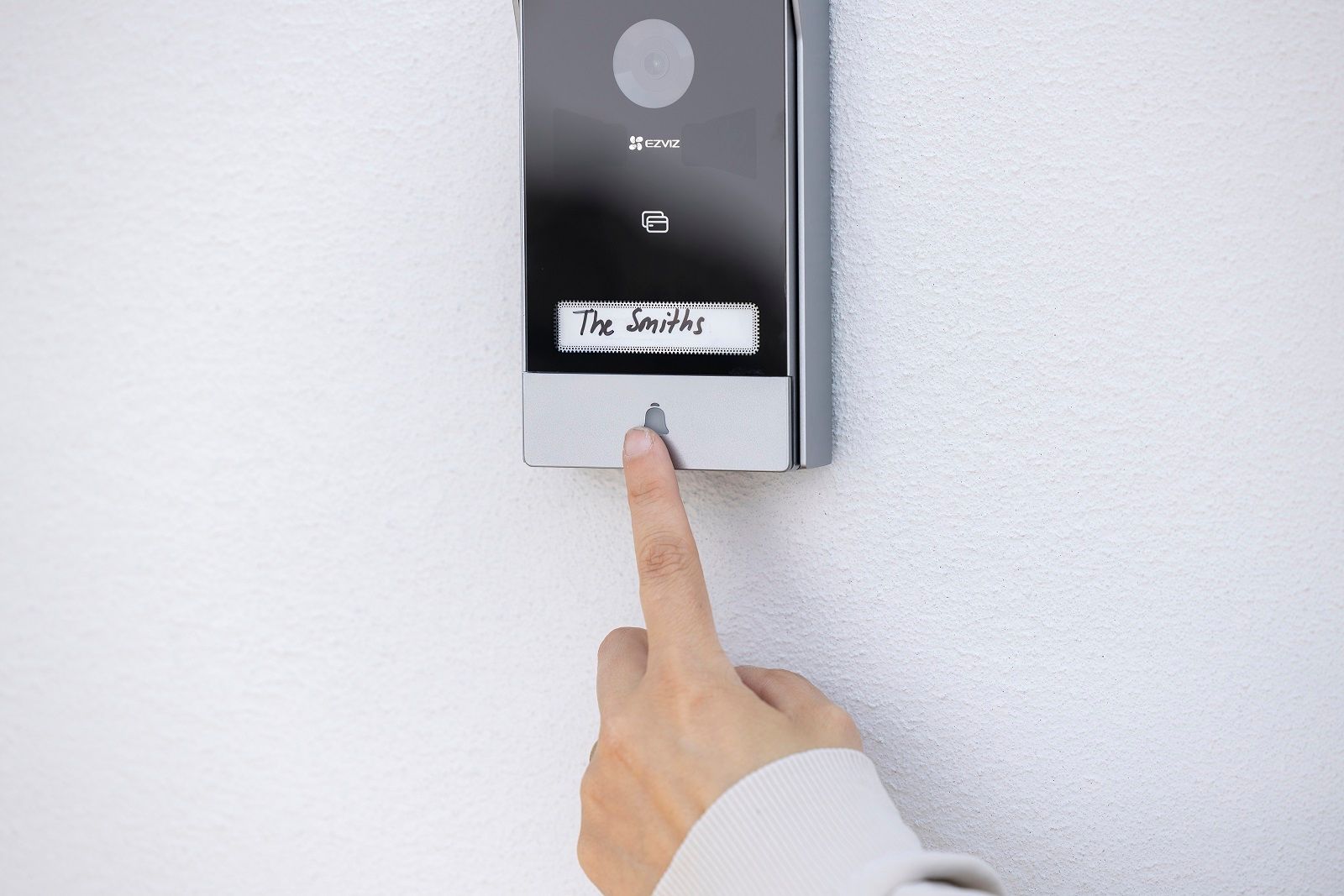 Hand Touching the Doorbell for the EZVIZ HP7