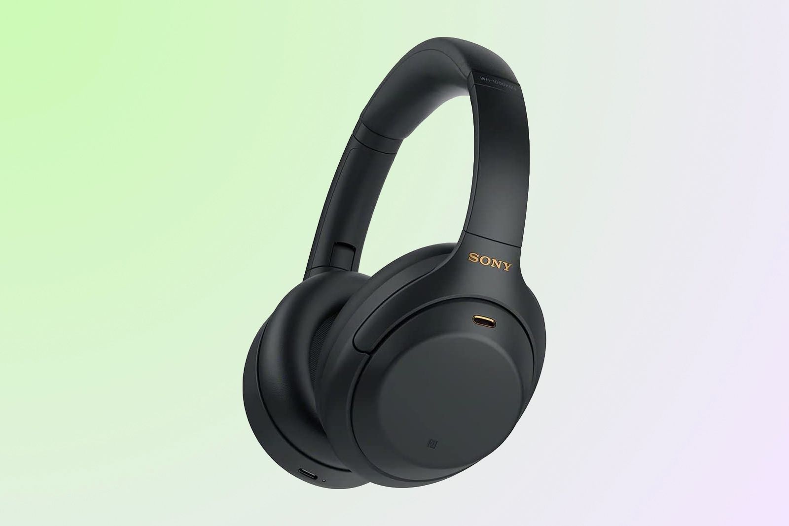 Black Sony headphones on a greenish-blue background.