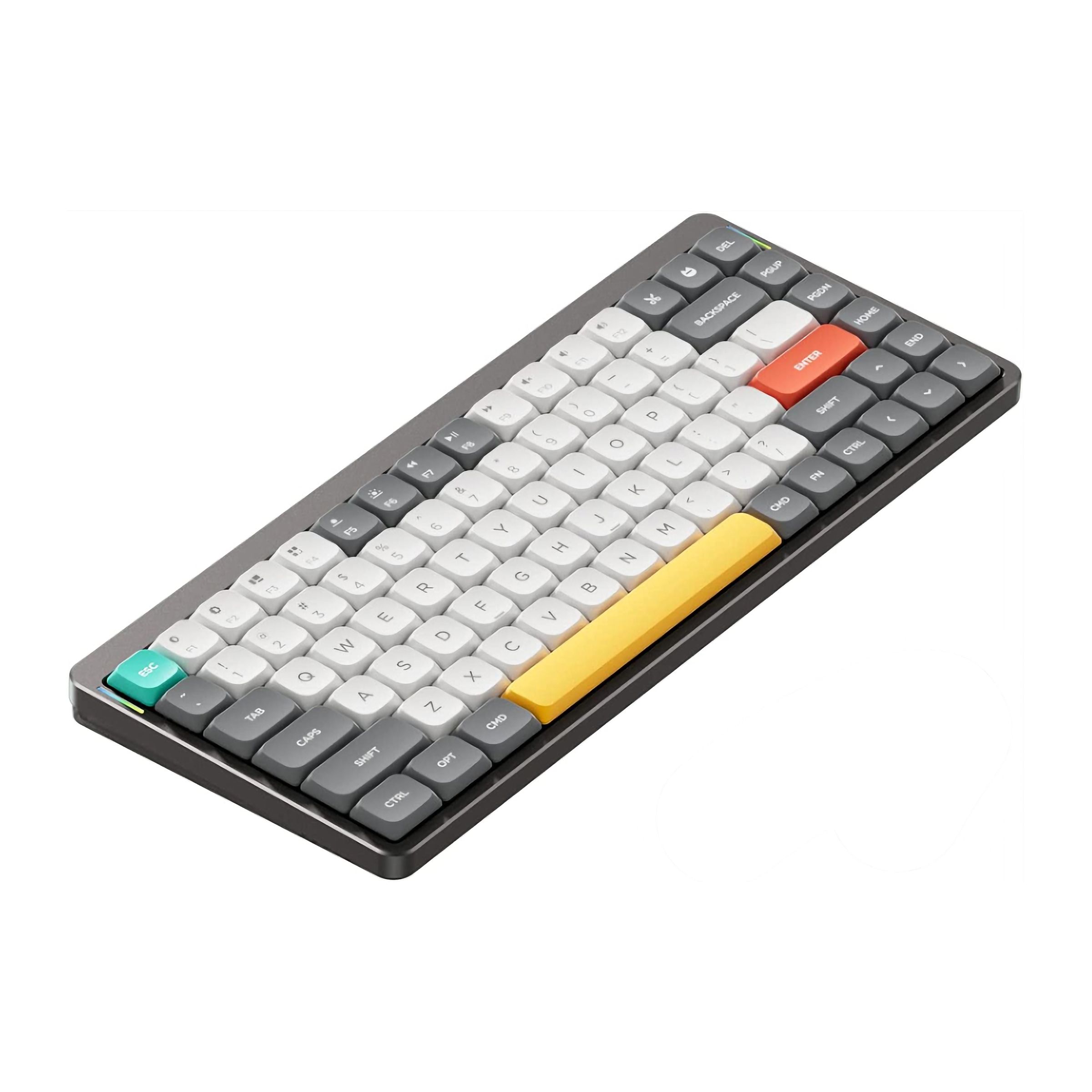 A low-profile mechanical keyboard with a yellow pace bar and an orange enter key.