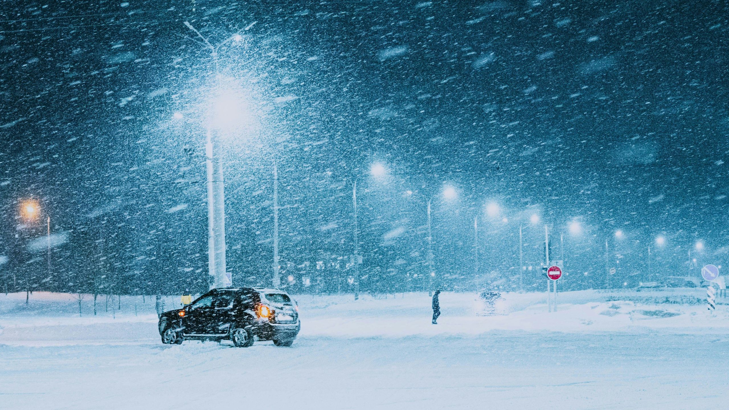 Car in blizzard lot with no one around from unsplash Artem Balashevsky 