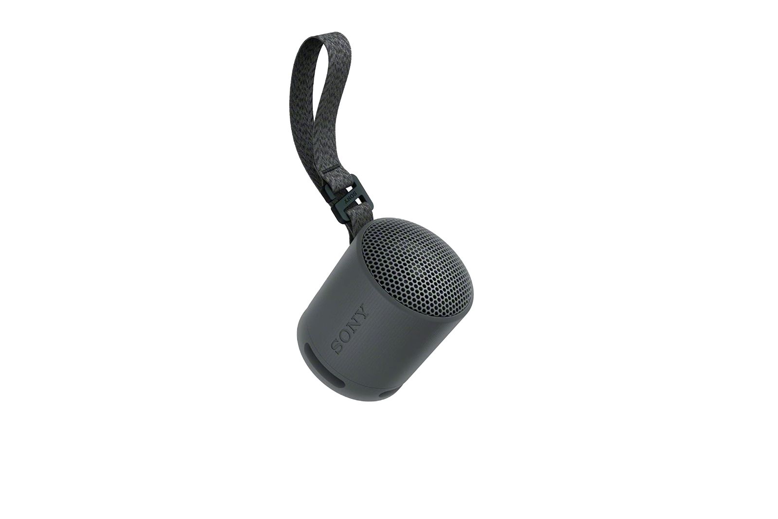 A tiny gray speaker with a strap coming out of the top.
