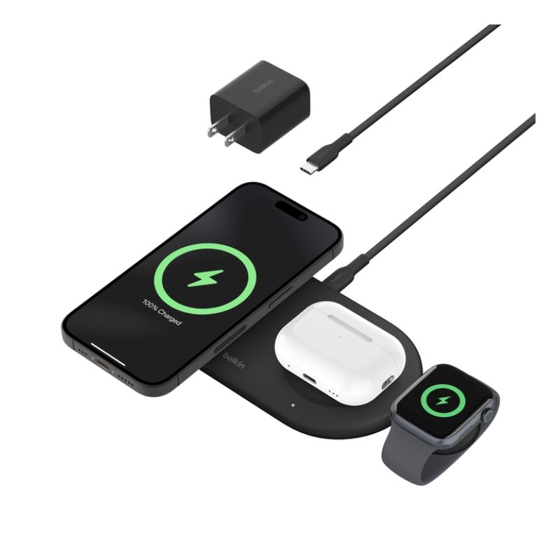 A wireless charging pad with an iPhone, AirPods Pro, and Apple Watch charging on it.