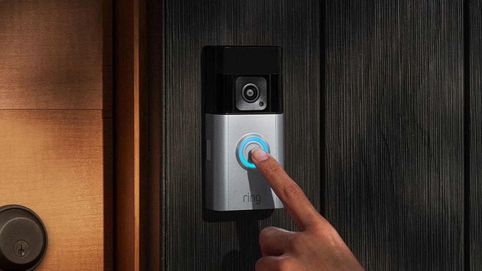A person touches Ring's new Battery Doorbell Pro. 