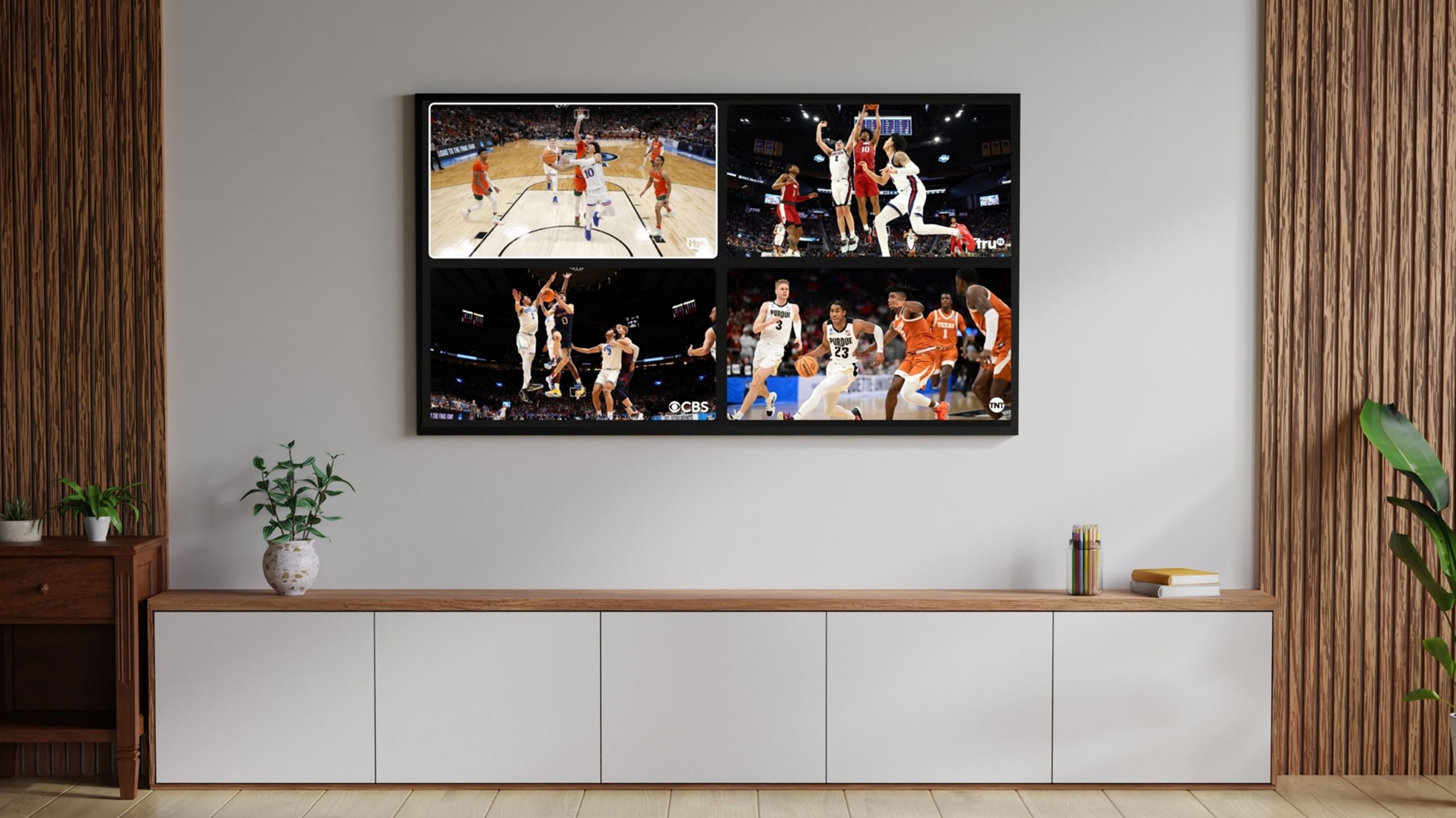 YouTube TV multiview mounted on a white living room wall. 