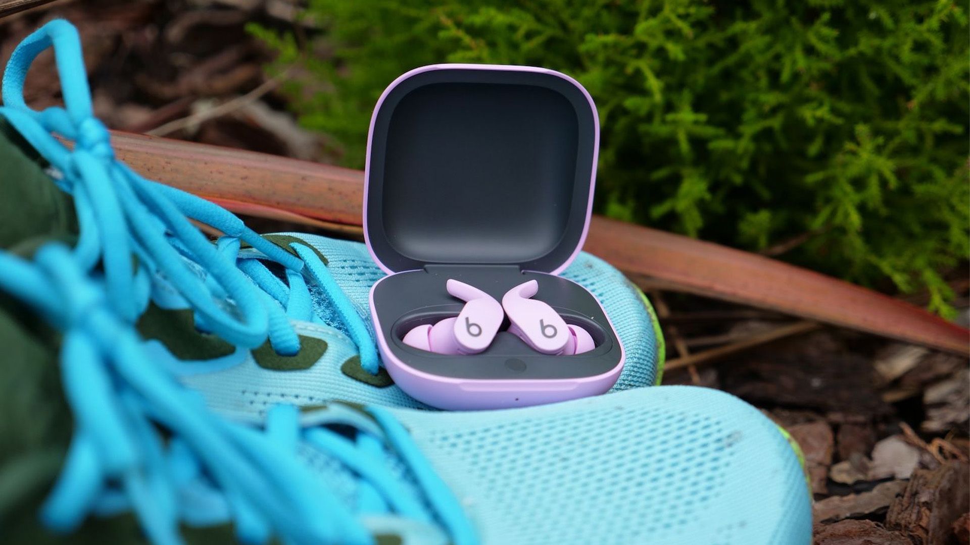 Earbuds in their charging case