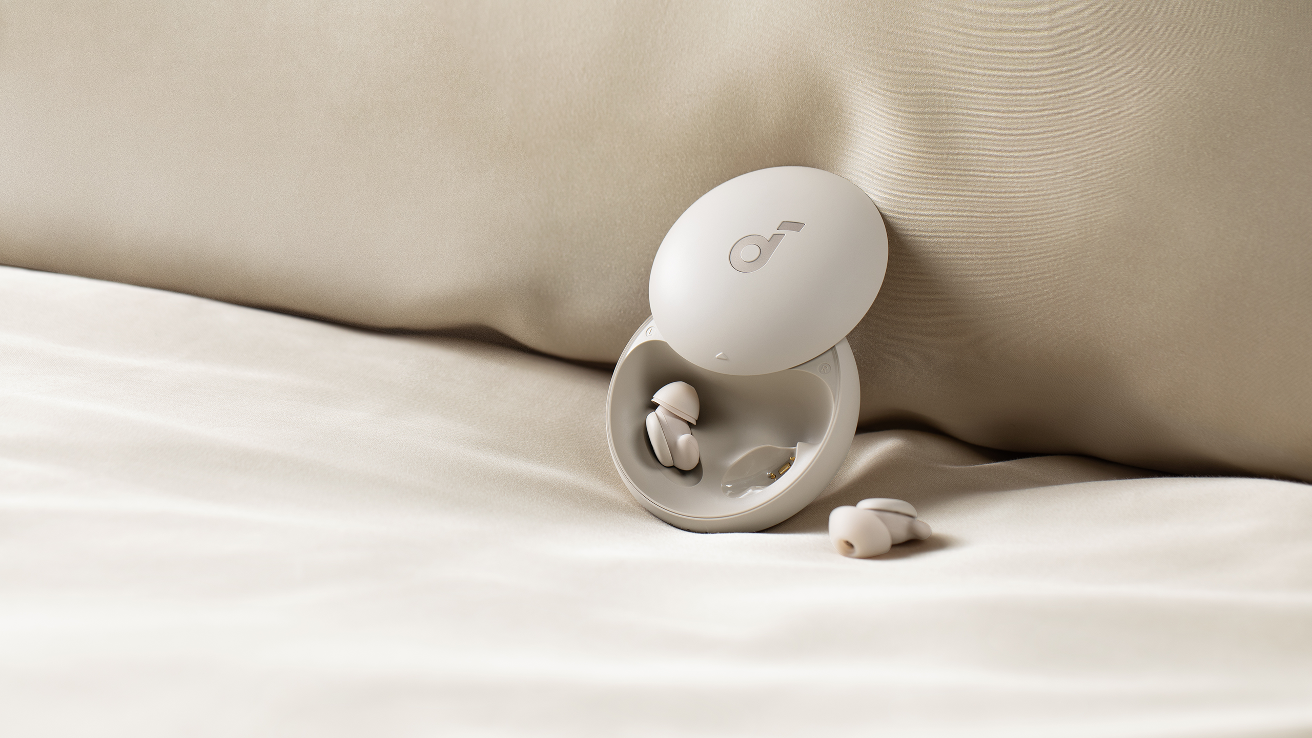 soundcore Sleep A20 earbuds on bed