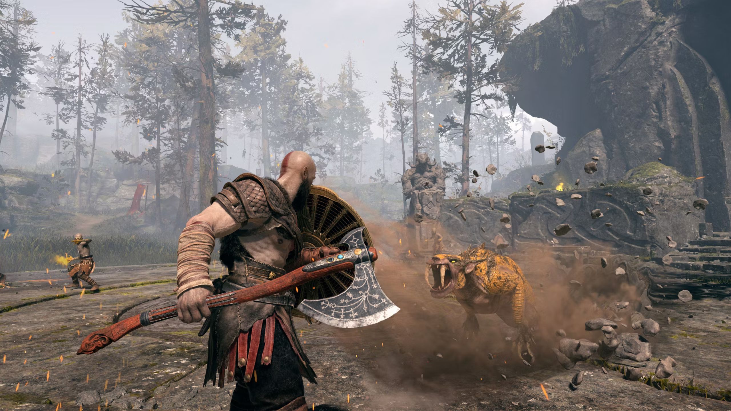 Kratos fighting beasts in God of War.