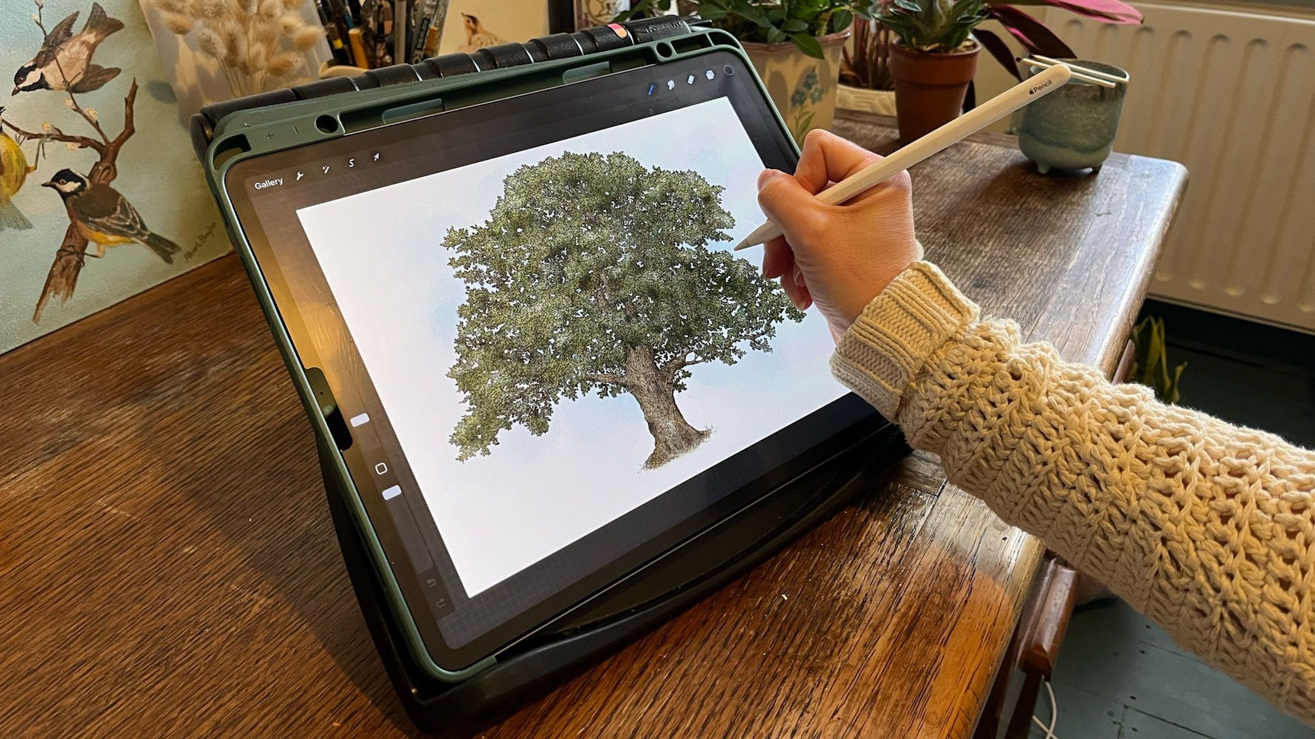 Jessie Bayliss painting a tree on her iPad