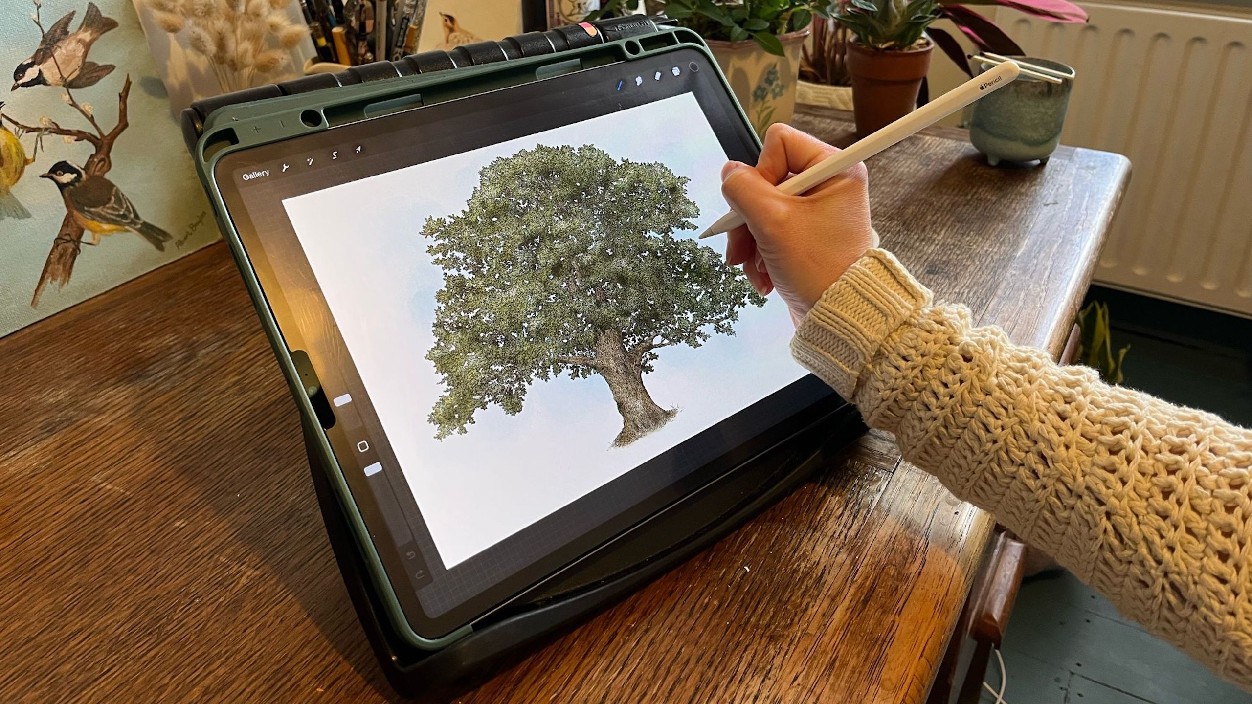 Jesse Bayliss paints a tree with an iPad