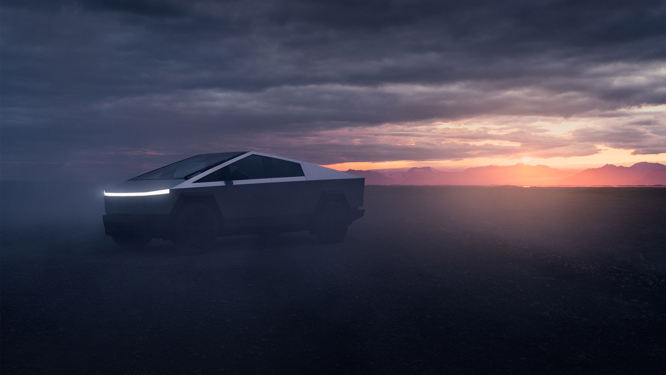 A Tesla Cybertruck illuminates its lights at dusk