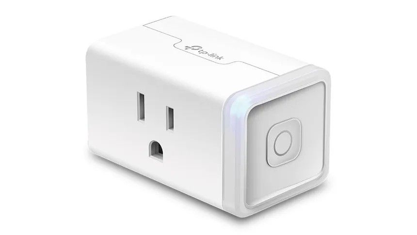 A TP Link Kasa smart plug on white