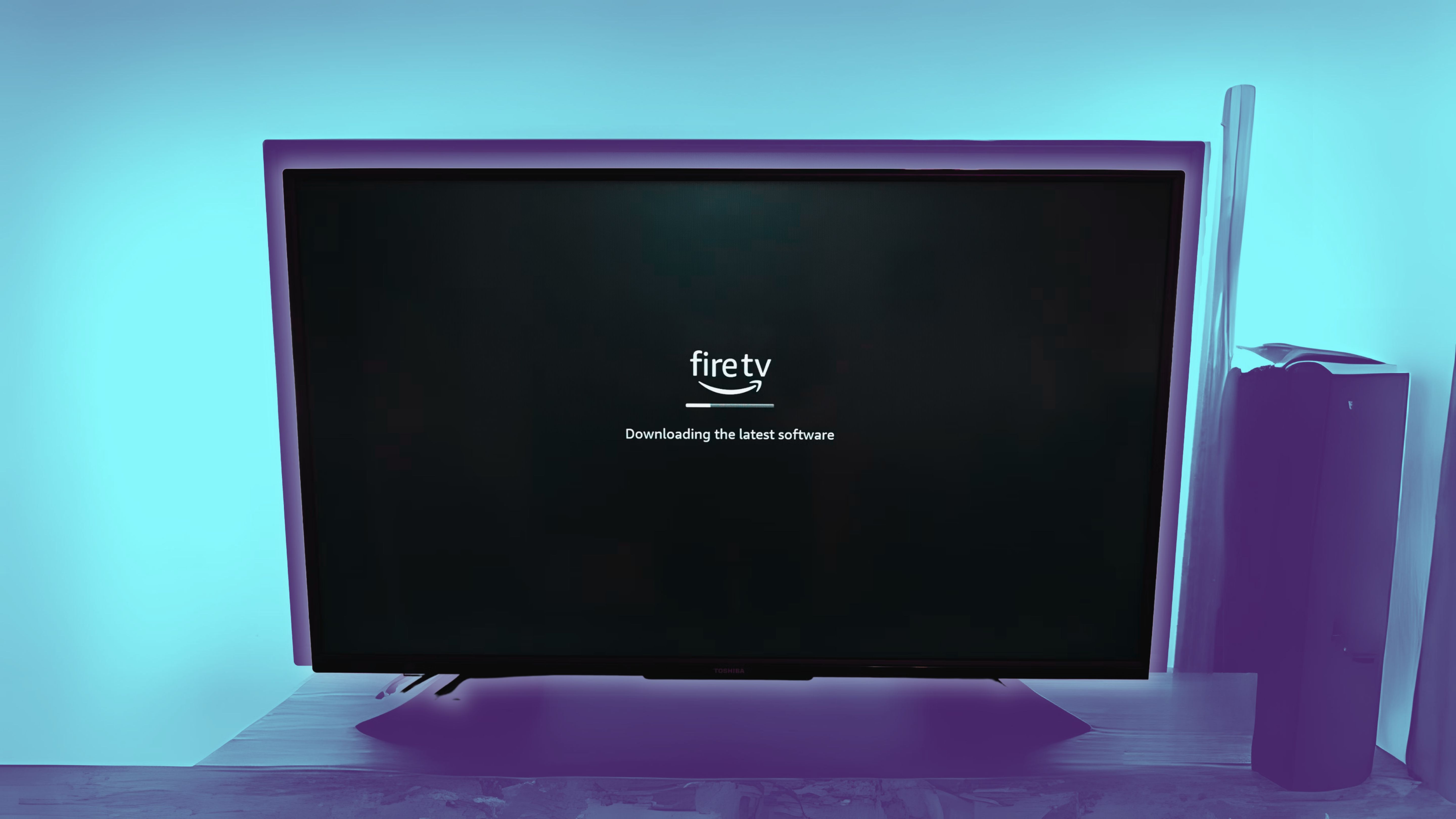 Fire TV running a software update against a blue background.