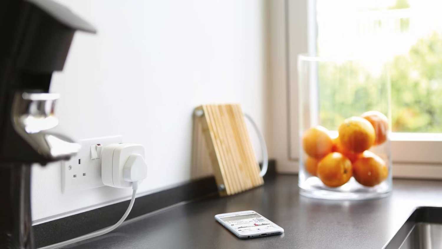 The Eve Smart Plug in a wall.