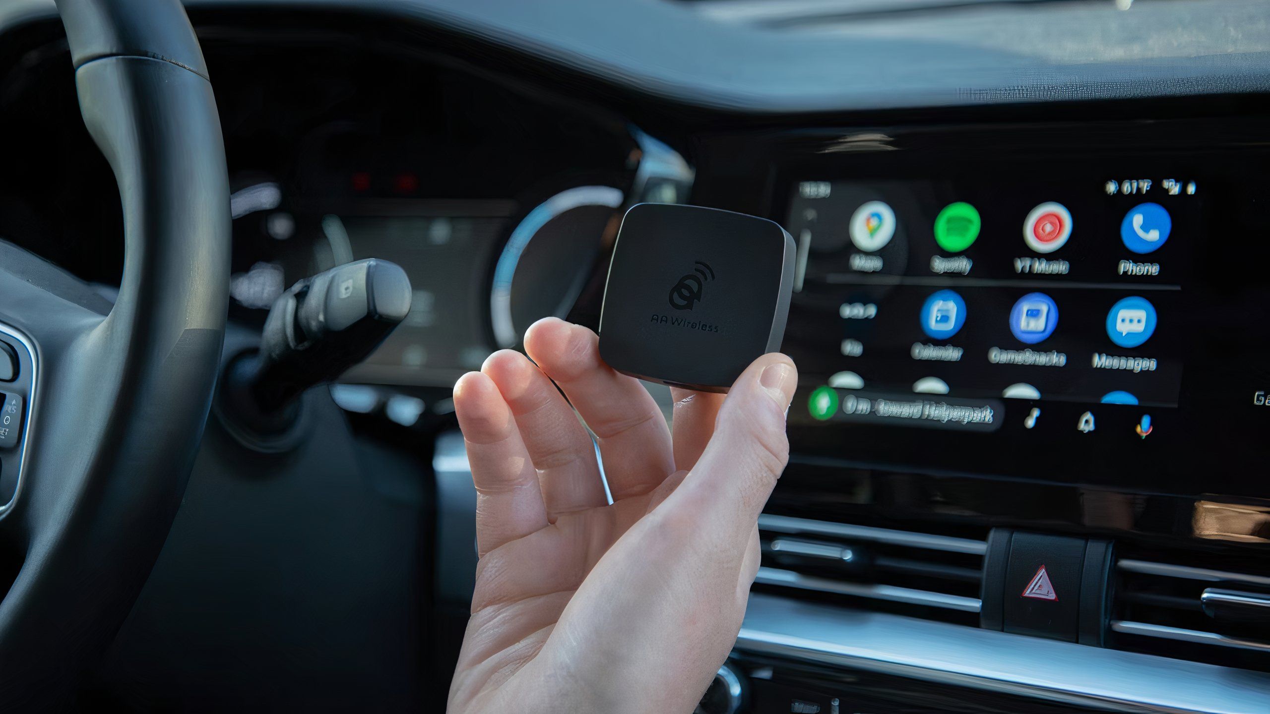 A hand holds aawireless android auto dongle