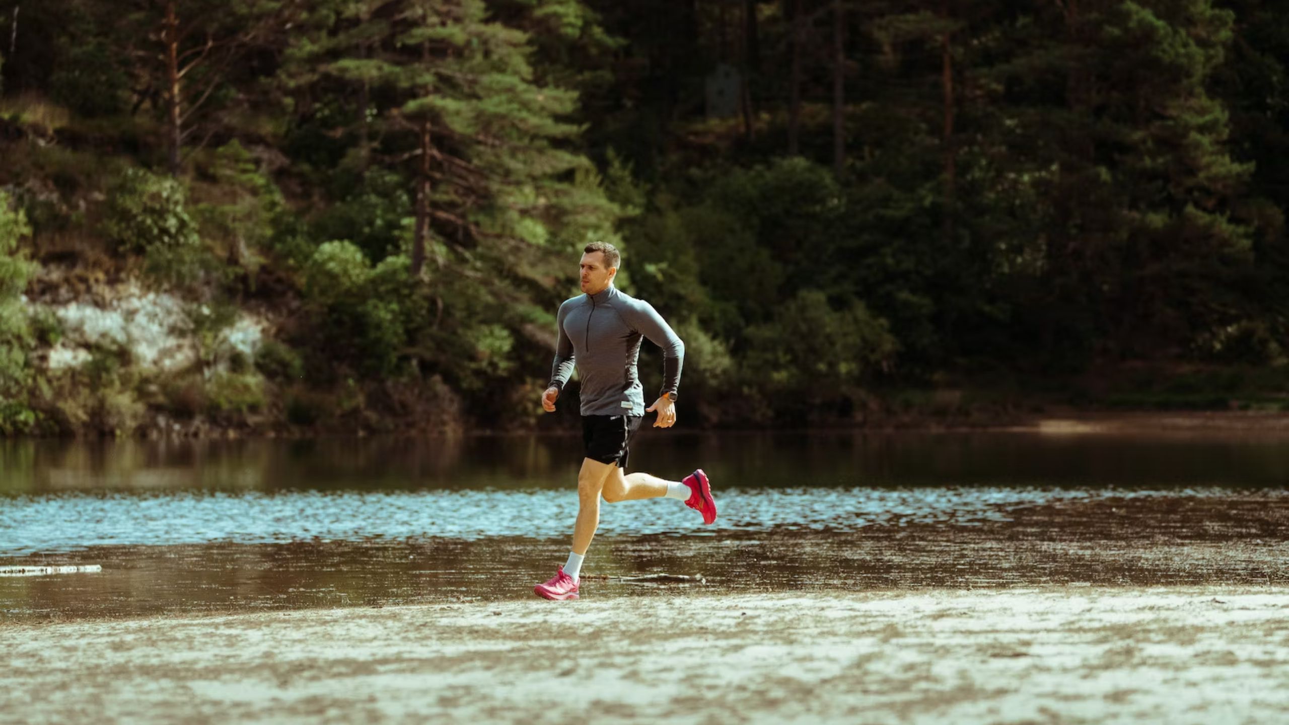 Loic Salan running in a creek with an Apple Watch Ultra 2 PL-2