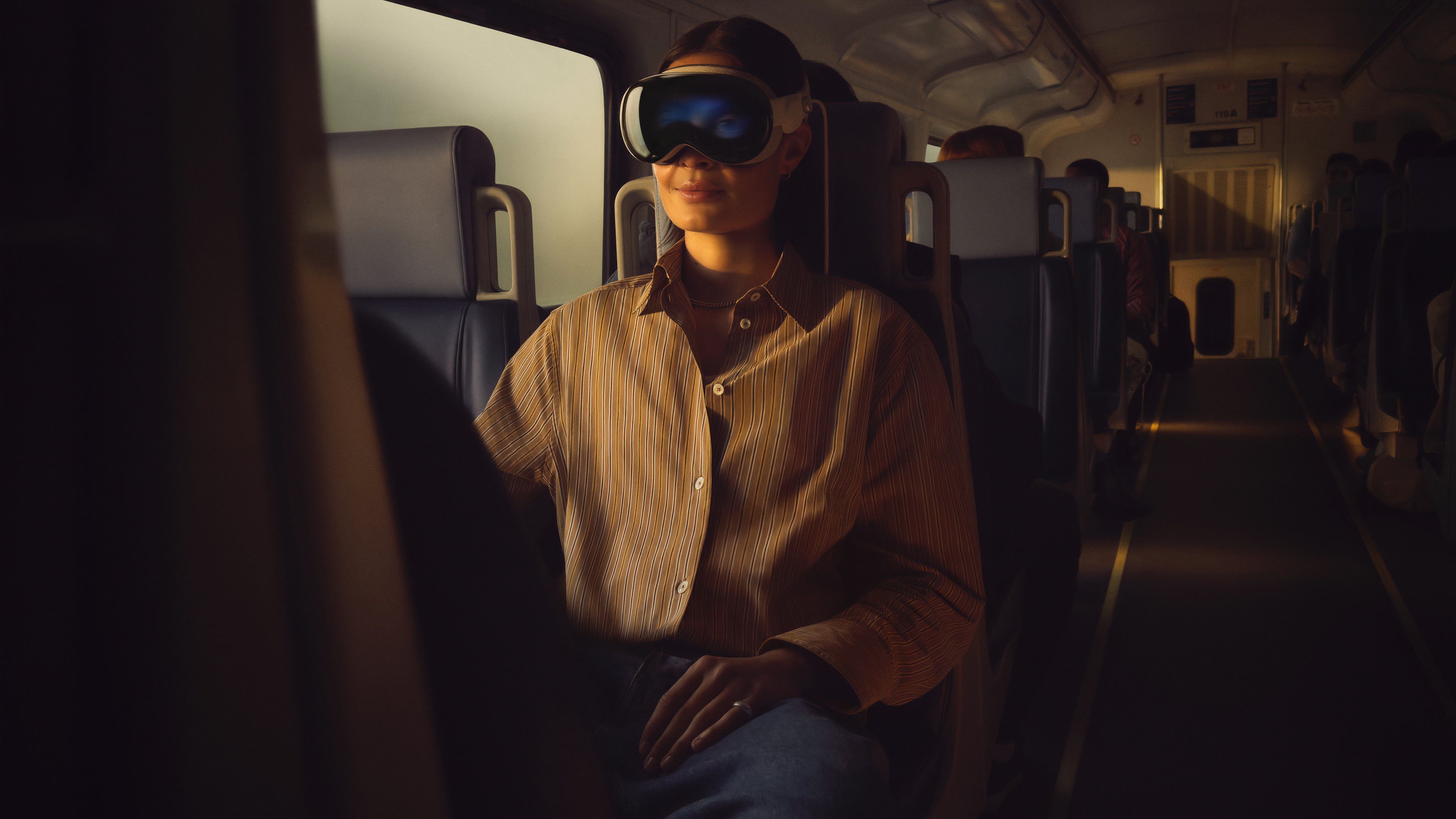 Someone wearing a Vision Pro while riding on a train.