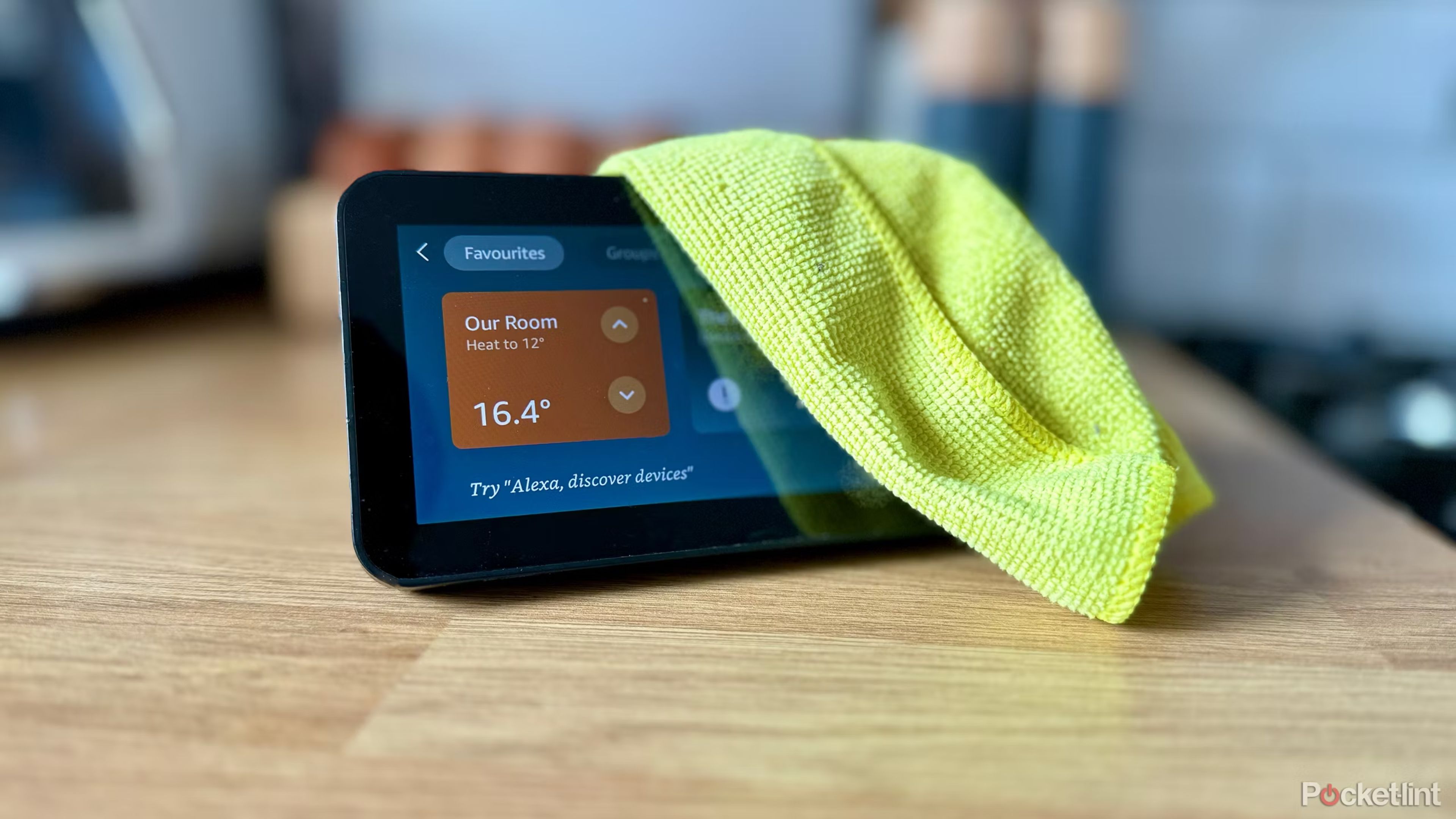 spring cleaning an echo show 5 with a microfiber towel