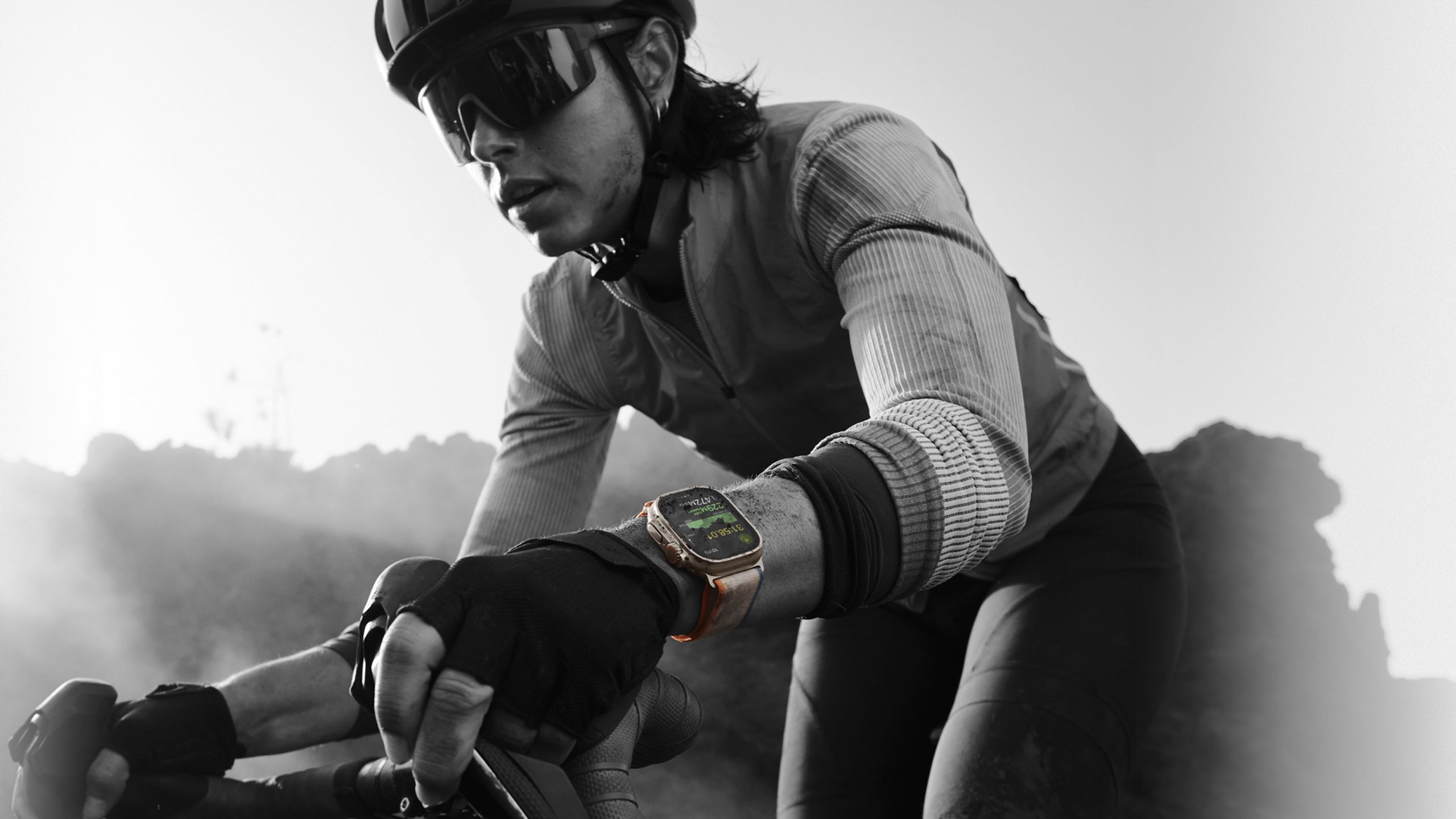 A cyclist wearing the Apple Watch Ultra 2.