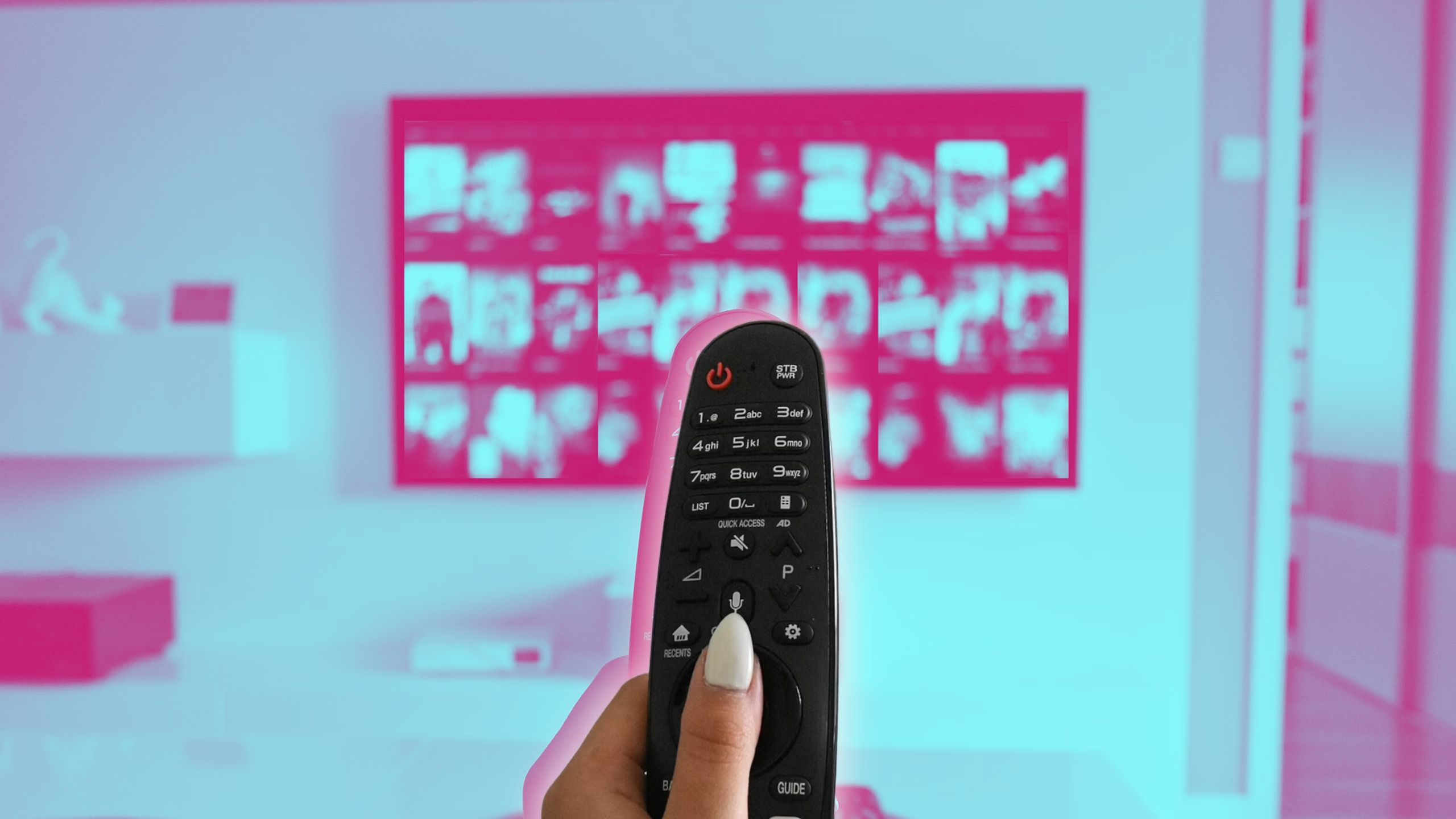 ​​​​​​​Someone holding a remote with a TV in the background