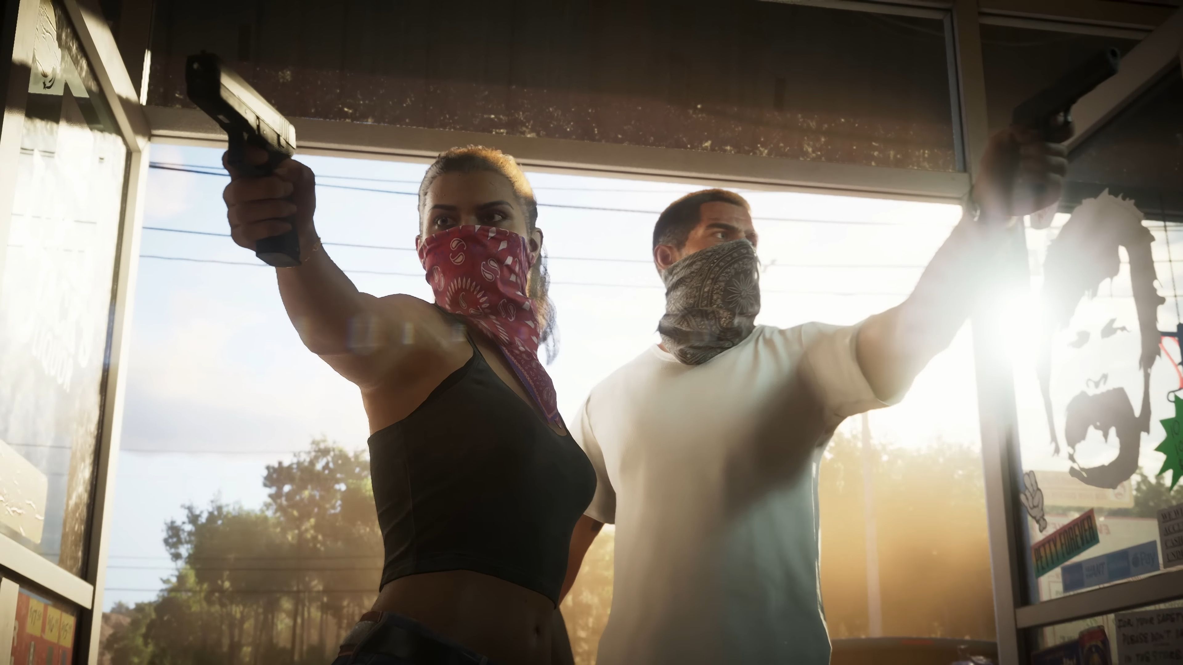 A screenshot from the GTA 6 trailer shows a masked woman and man pointing guns at the camera. 