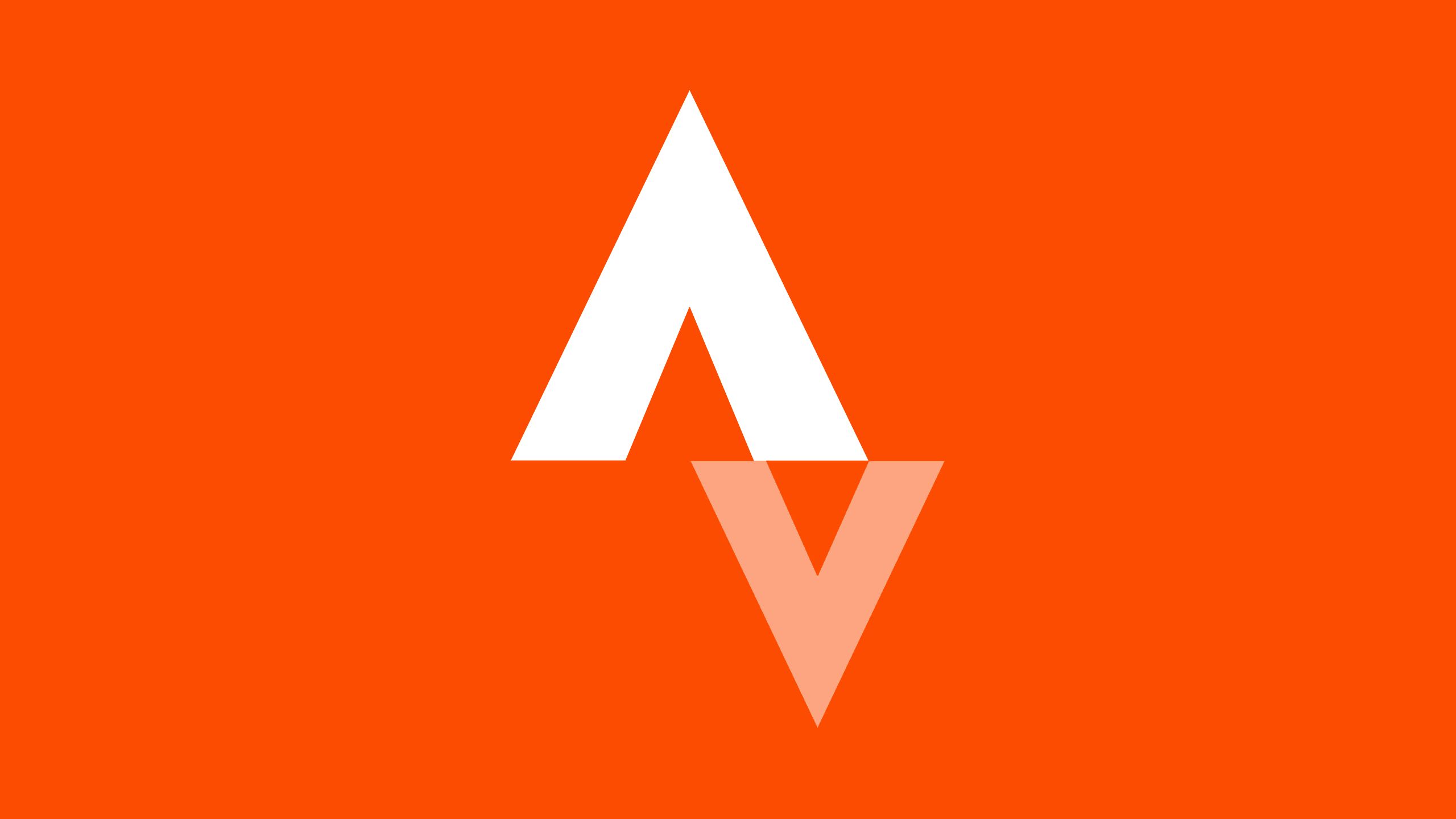 A white triangle and upside down gray triangle against an orange background. 