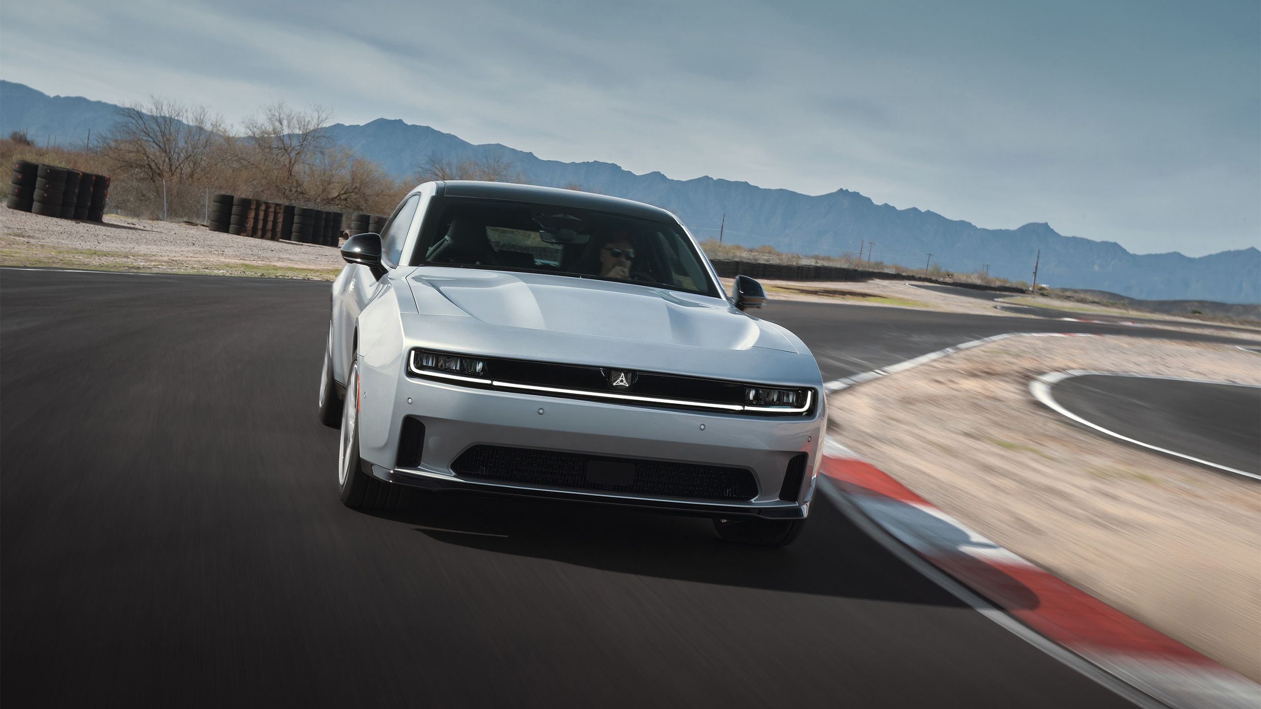 2024 Dodge Charger Daytona EV front driving on the track.