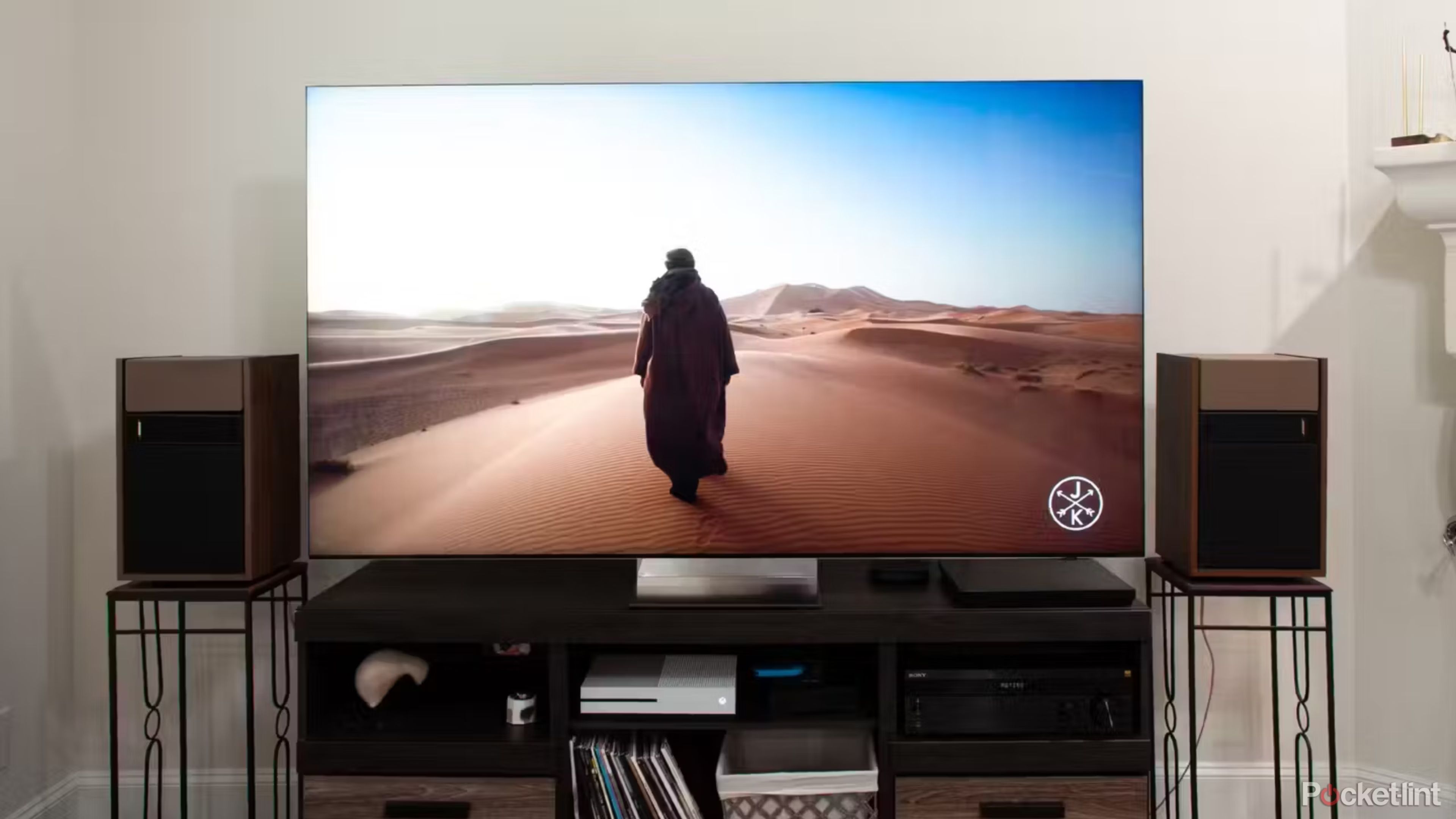 Samsung QN900D 8K TV shows a man walking in the desert