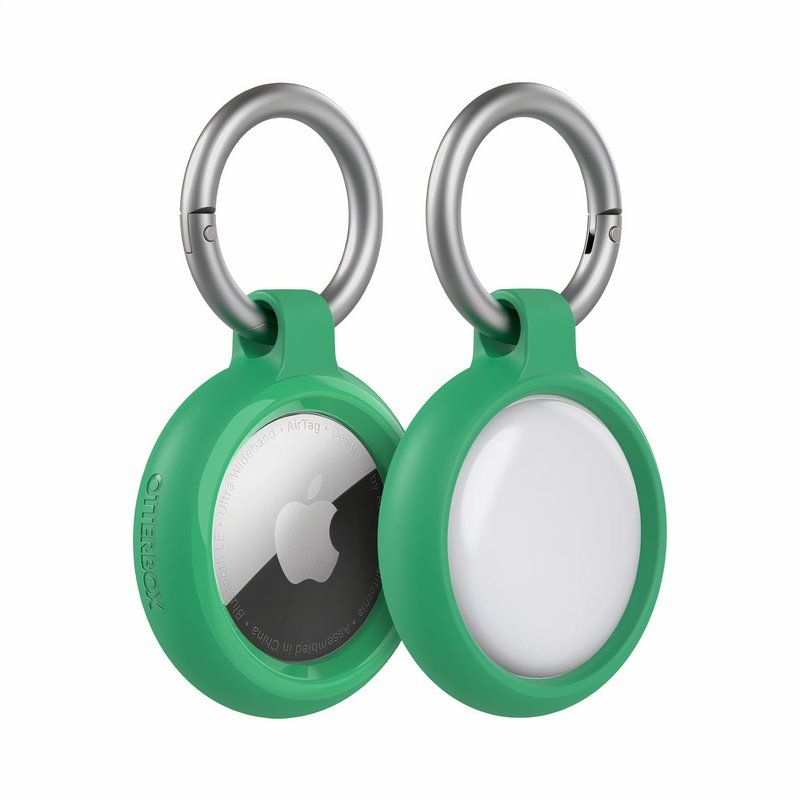 A green plastic case and a key chain wrapped around the Air Tag.