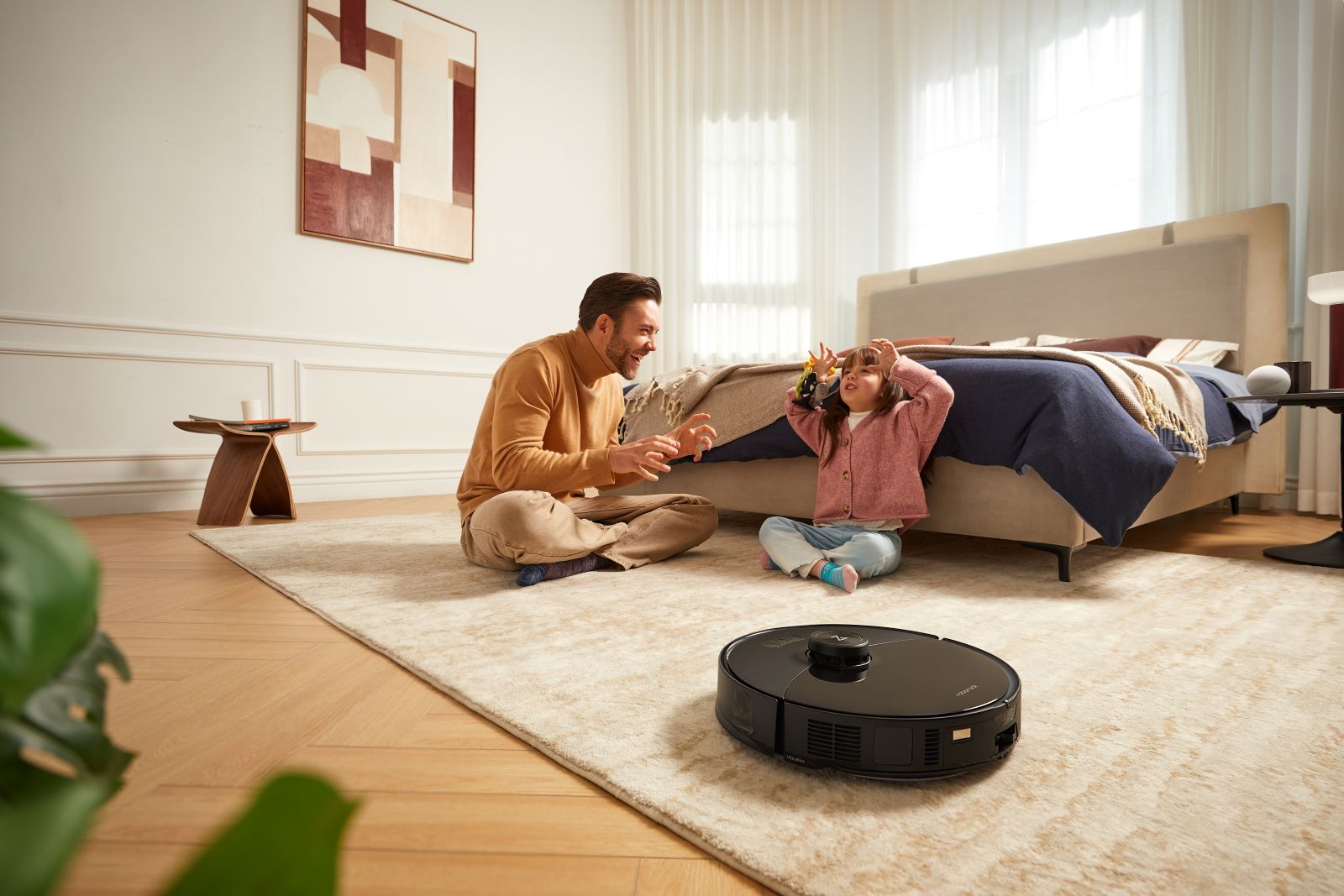 Father and child playing on carpet with Roborock vacuum in foreground