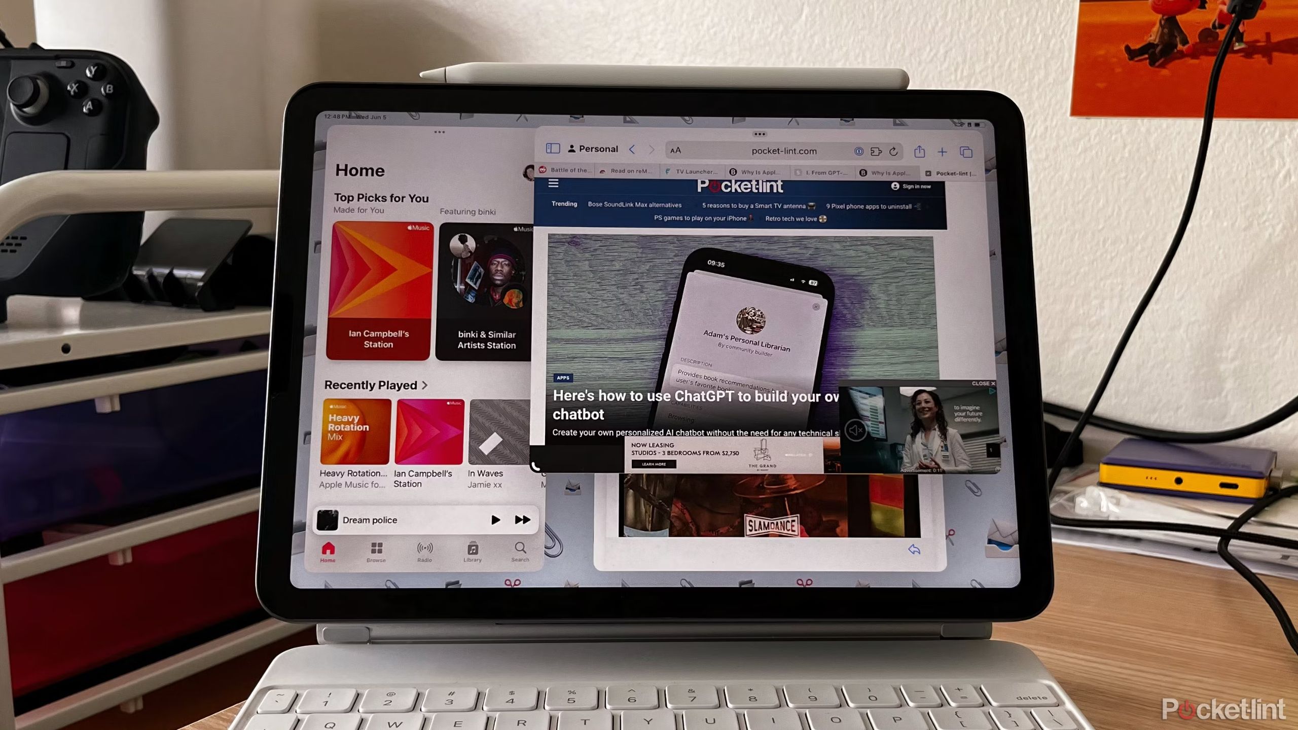 An iPad Air mounted on a Magic Keyboard and showing Stage Manager.