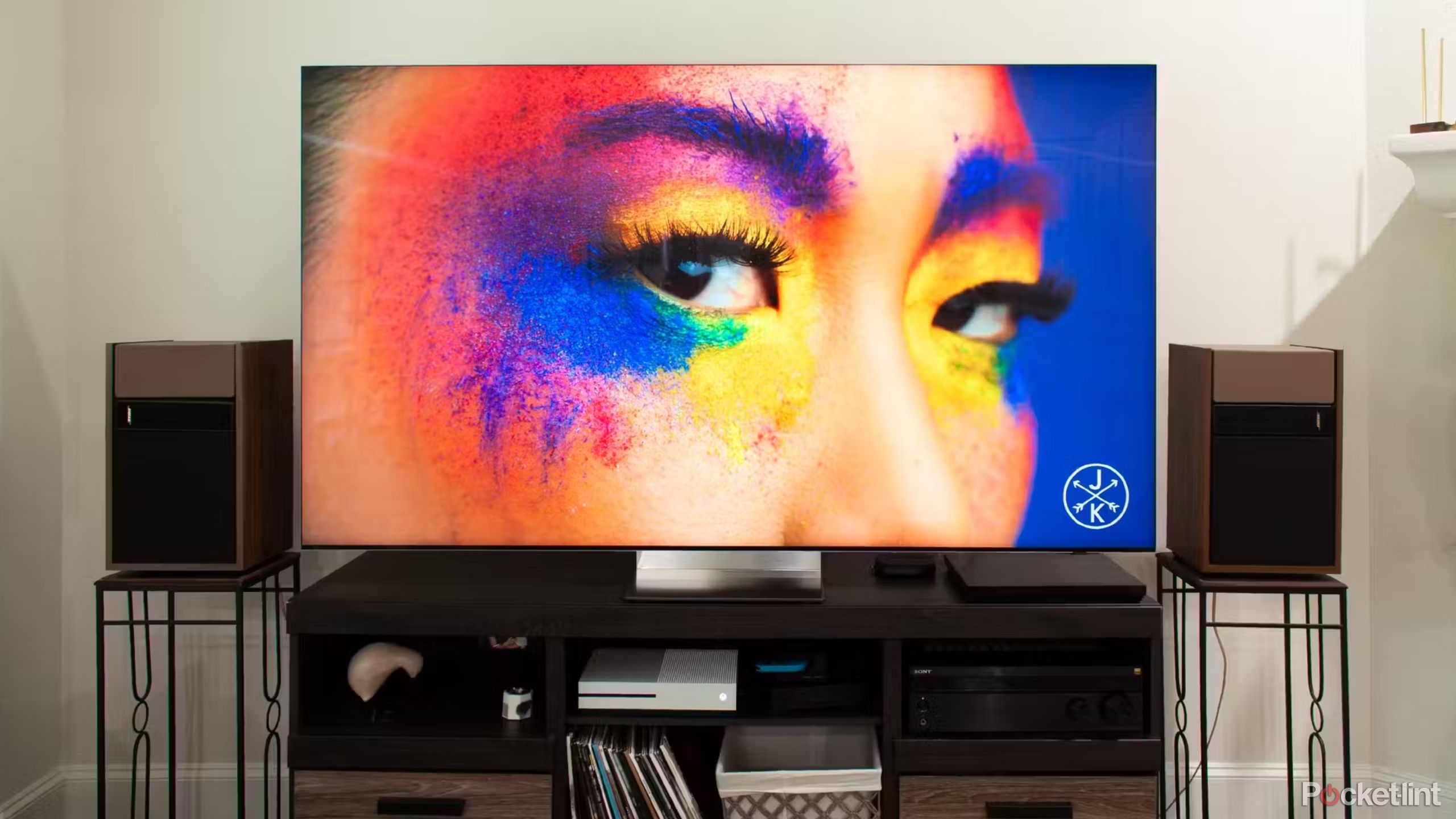 Samsung QN900D 8K TV with a woman with paint on her face. 