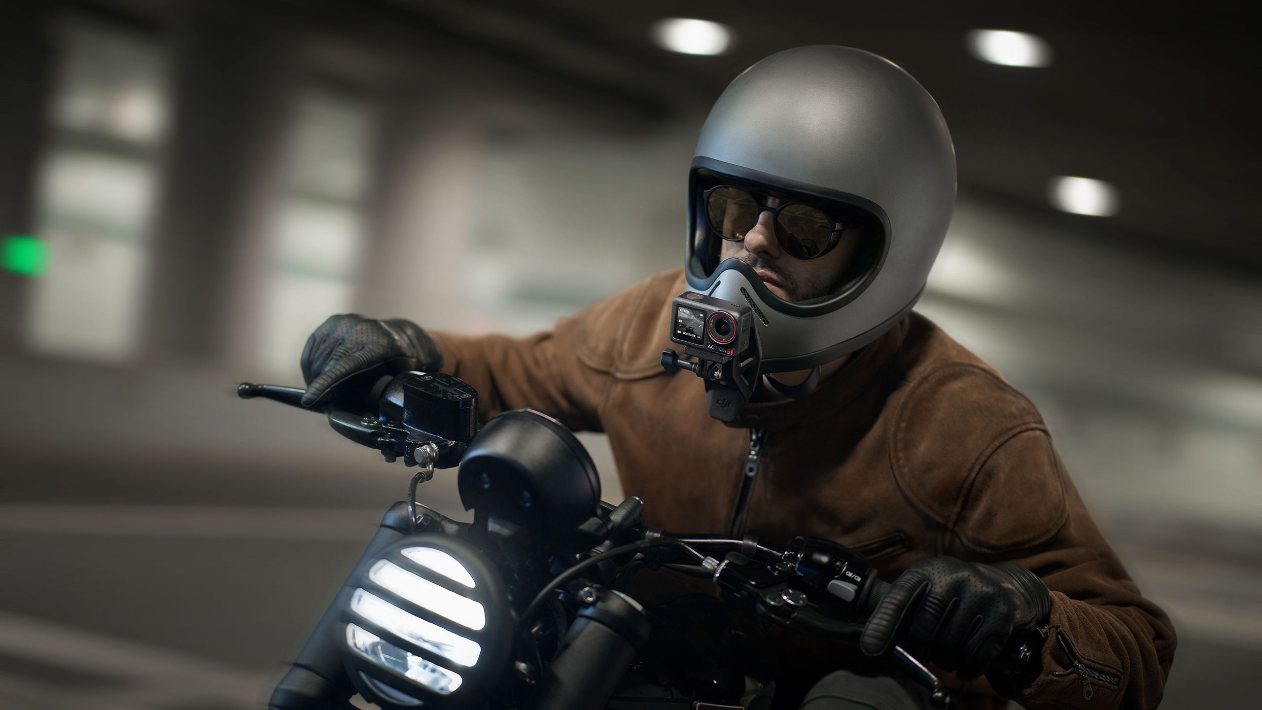 The DJI Osmo Action 5 Pro mounted on a motorcyclist's helmet