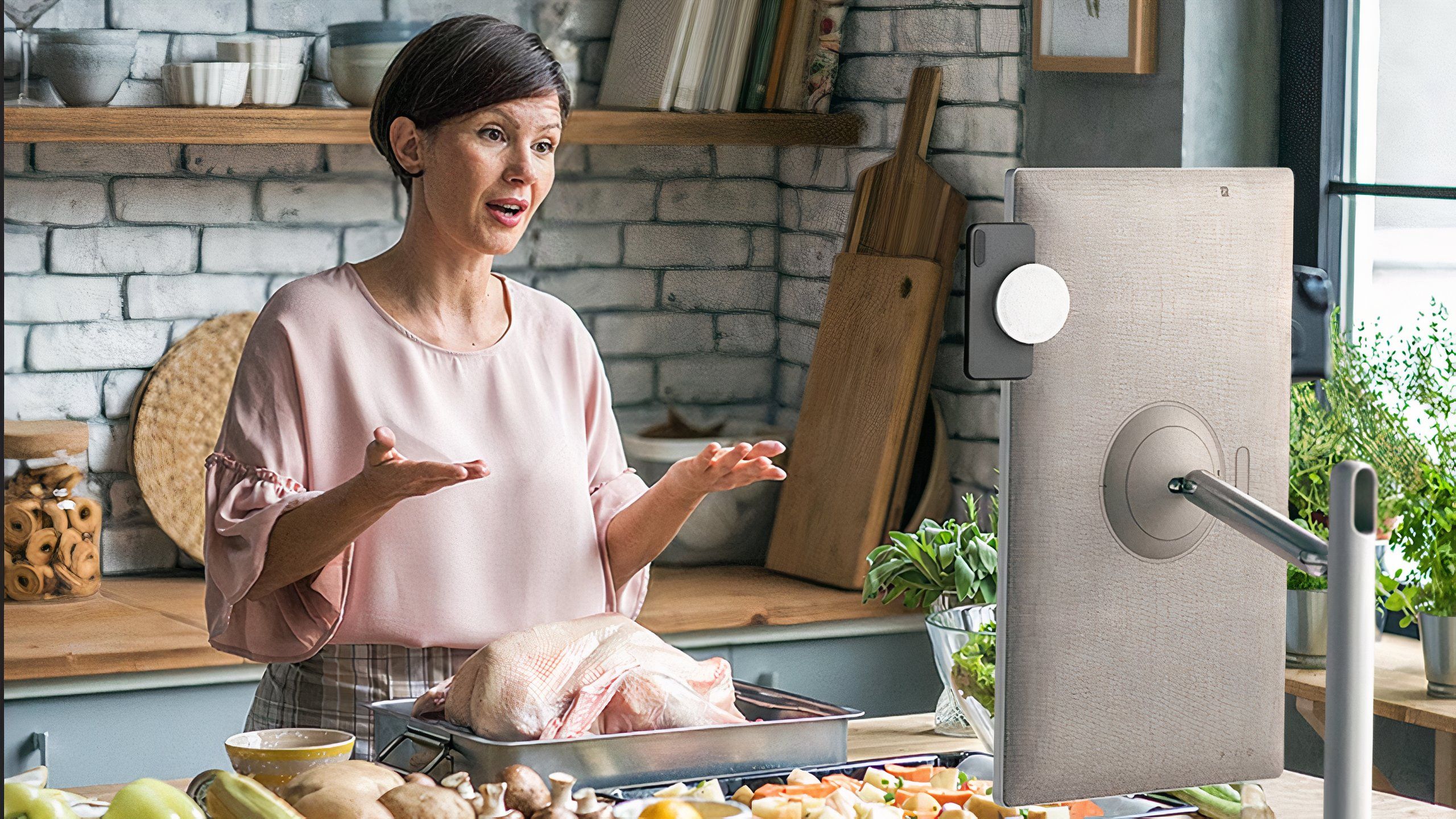 Woman cooking in front of LG portable TV